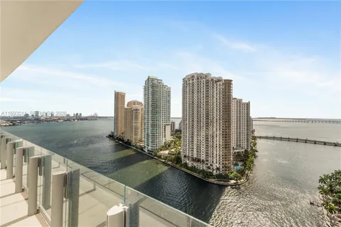 a view of lake and city with ocean