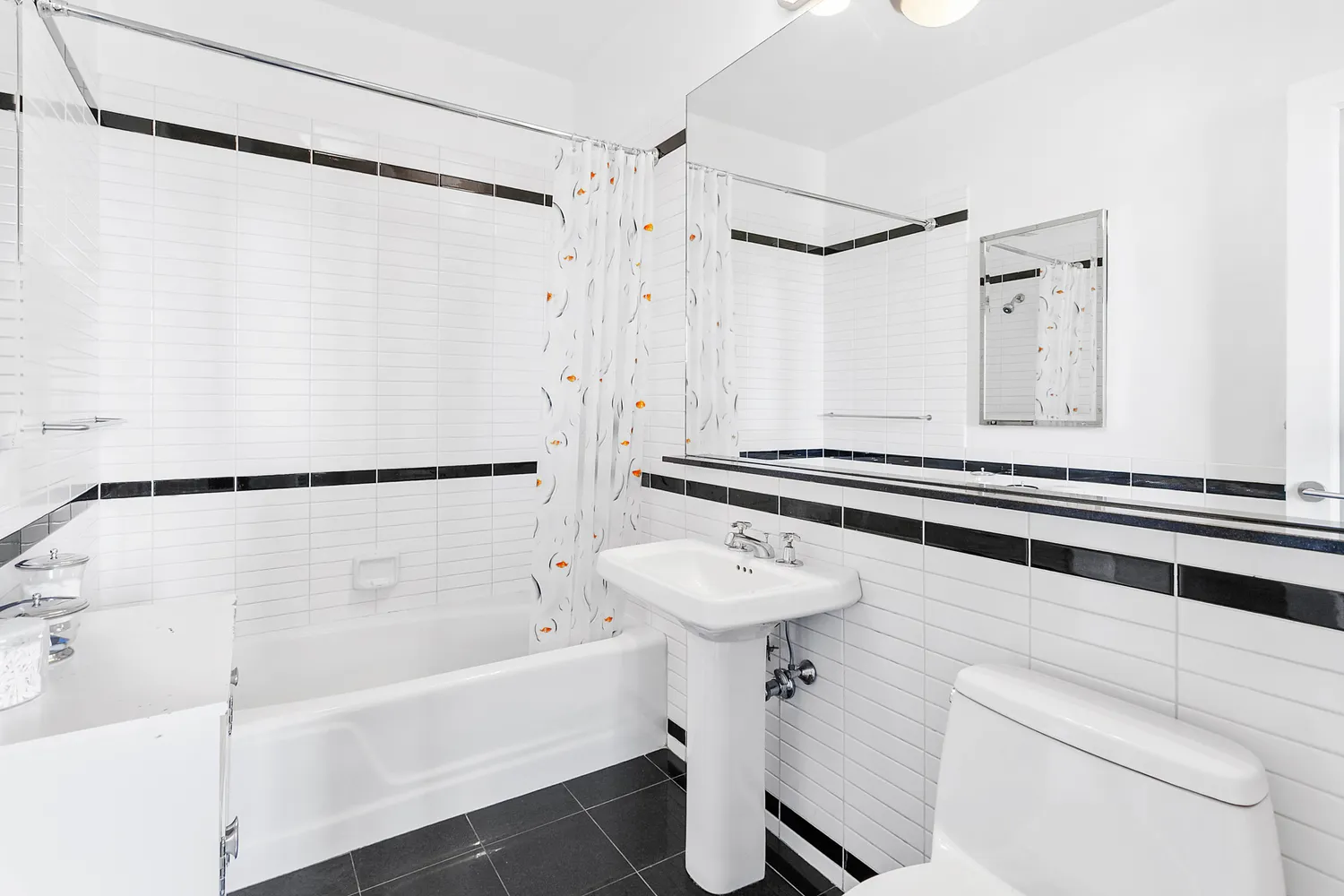 a bathroom with a sink a mirror a bathtub and shower