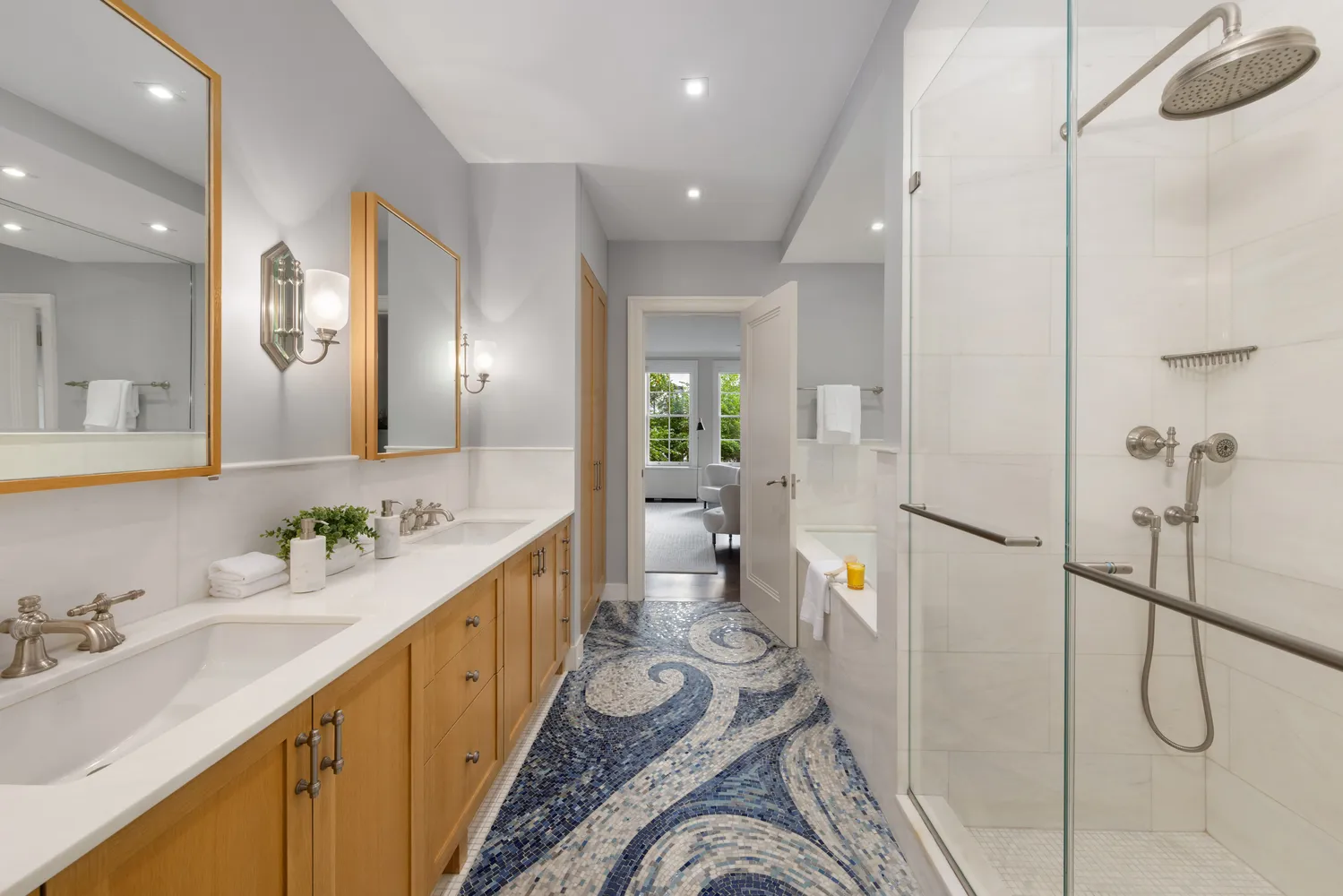 a bathroom with a double vanity sink mirror and shower