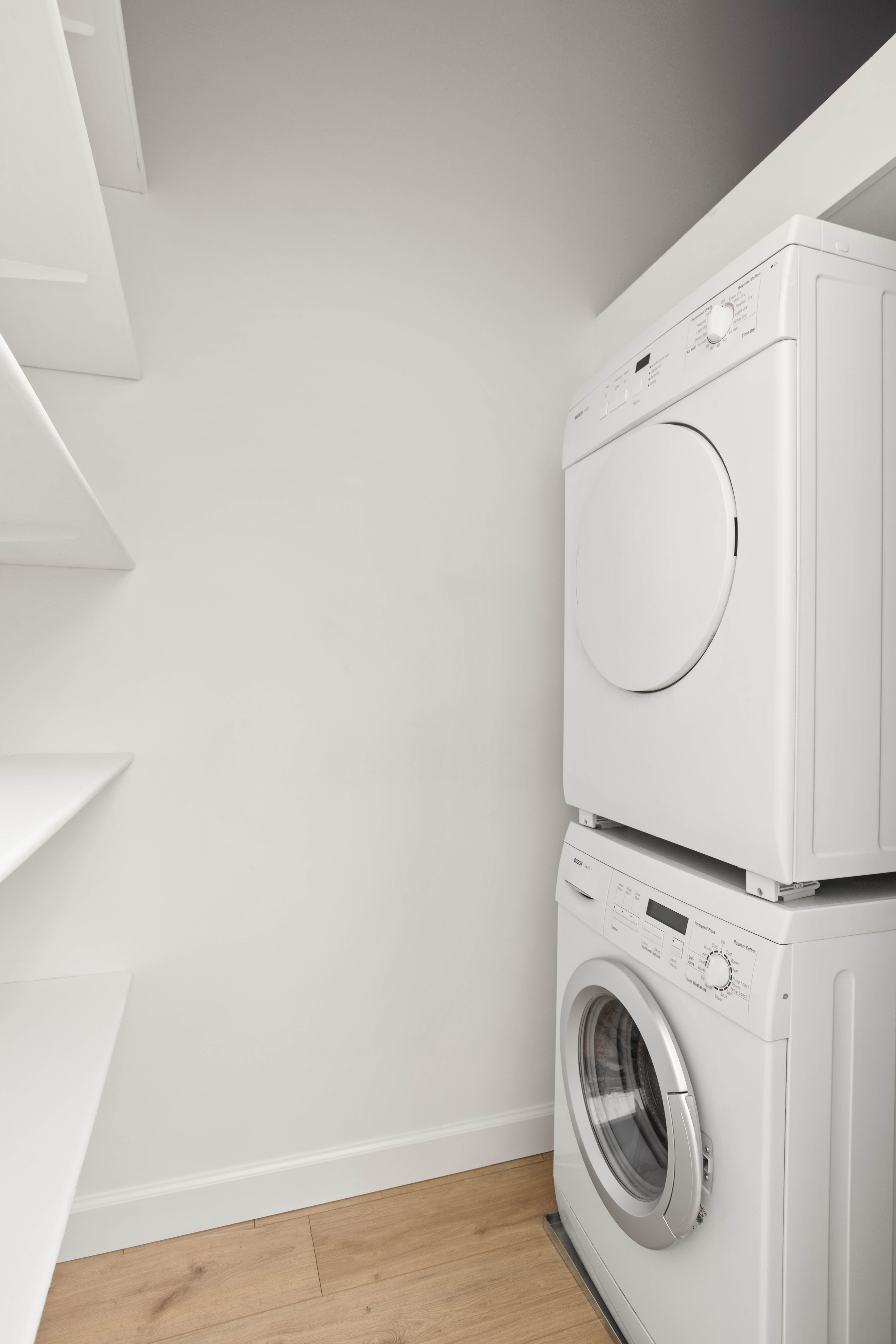 357 West 20th Street, Unit B Manhattan, NY 10011 - Photo 7 of 10 a utility room with dryer and washer