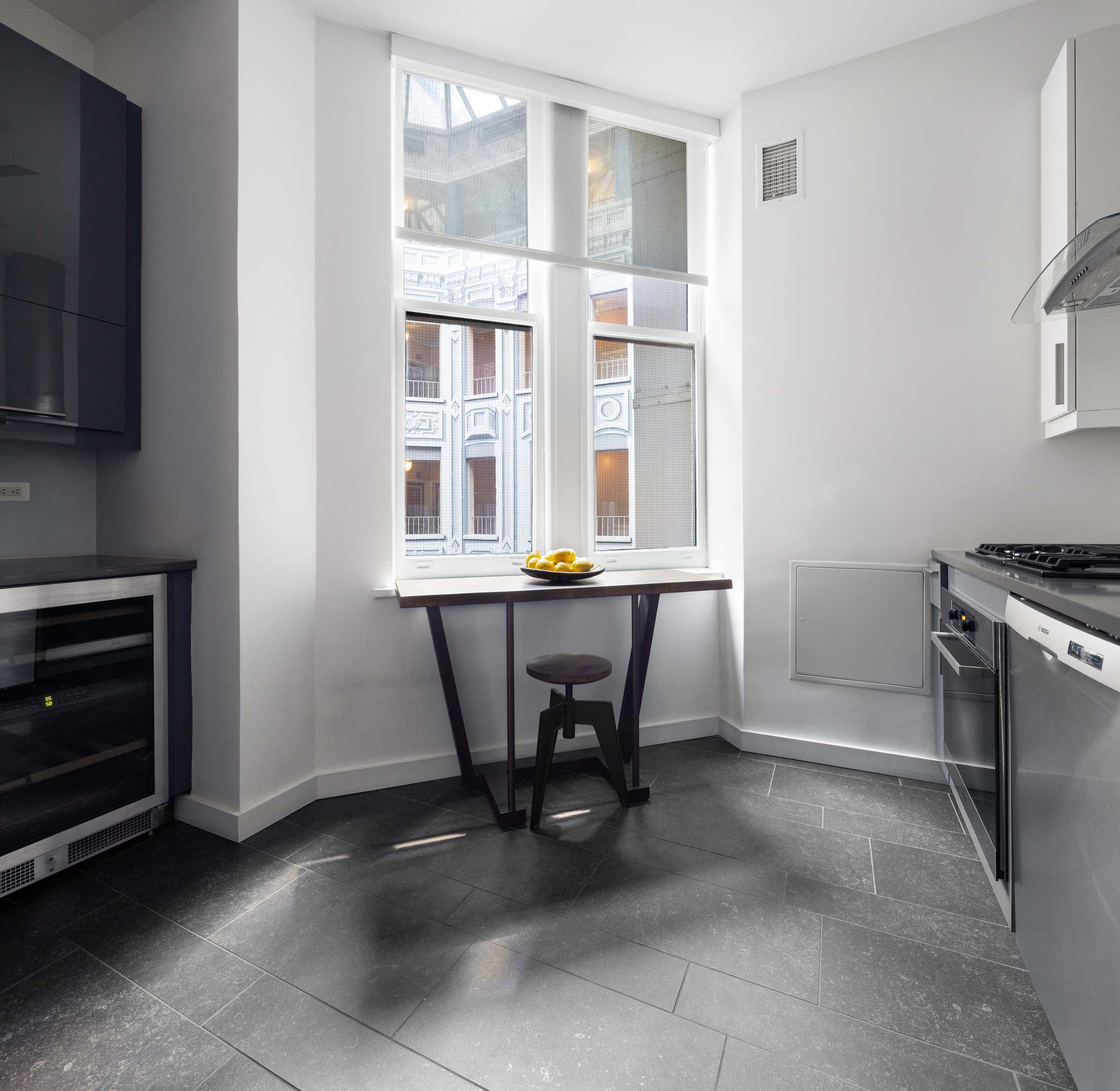 180 West 58th Street, Unit 11A Manhattan, NY 10019 - Photo 9 of 17 a view of a dining room with furniture and a window