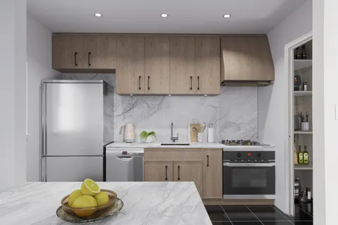 a kitchen with a sink cabinets and stainless steel appliances