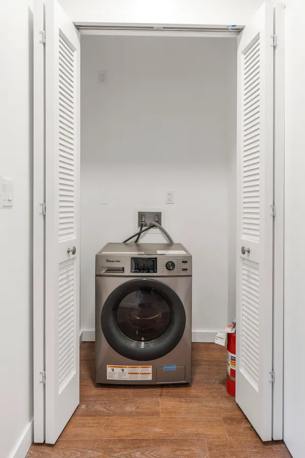 a utility room with washing machine