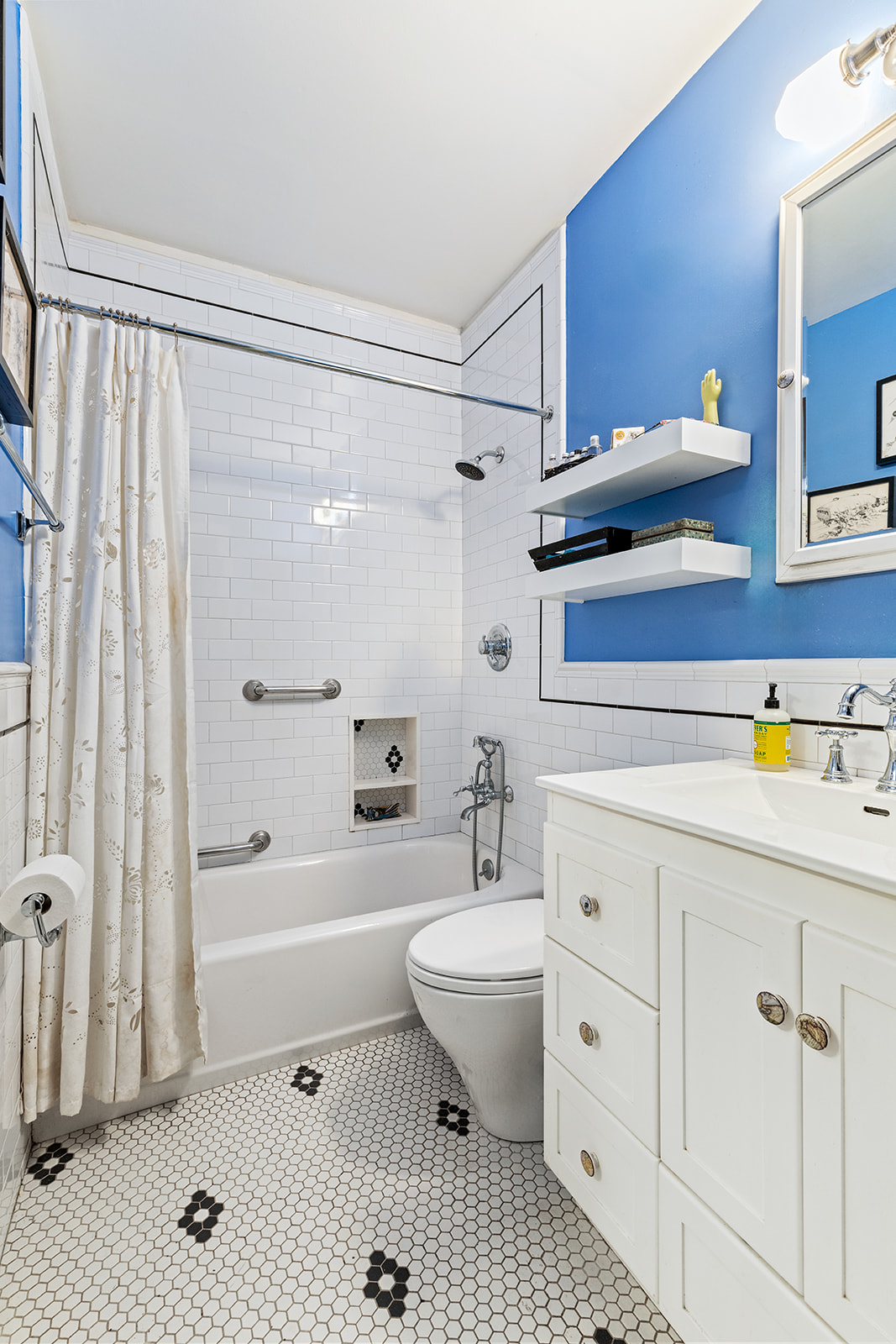 110 Clinton Avenue, Unit 1A Brooklyn, NY 11205 - Photo 4 of 9 a bathroom with a sink a toilet and shower