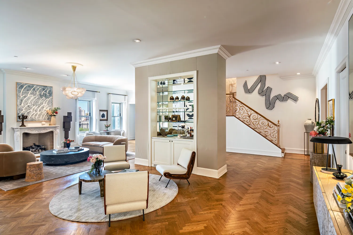 a living room with furniture and a dining table