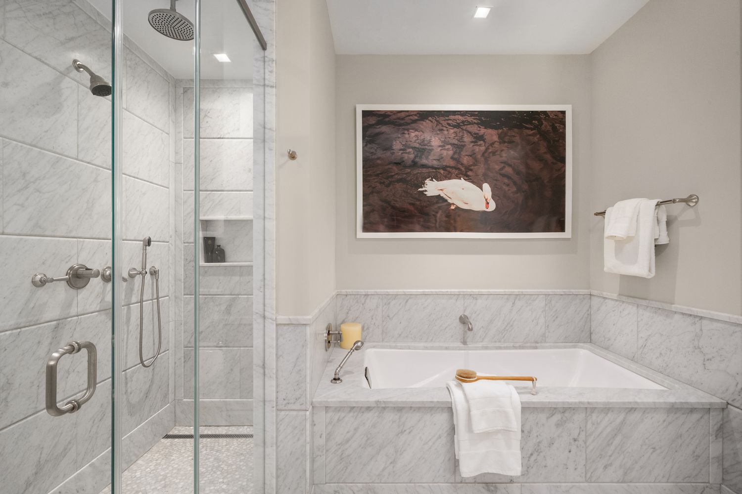 a bathroom with a tub and shower