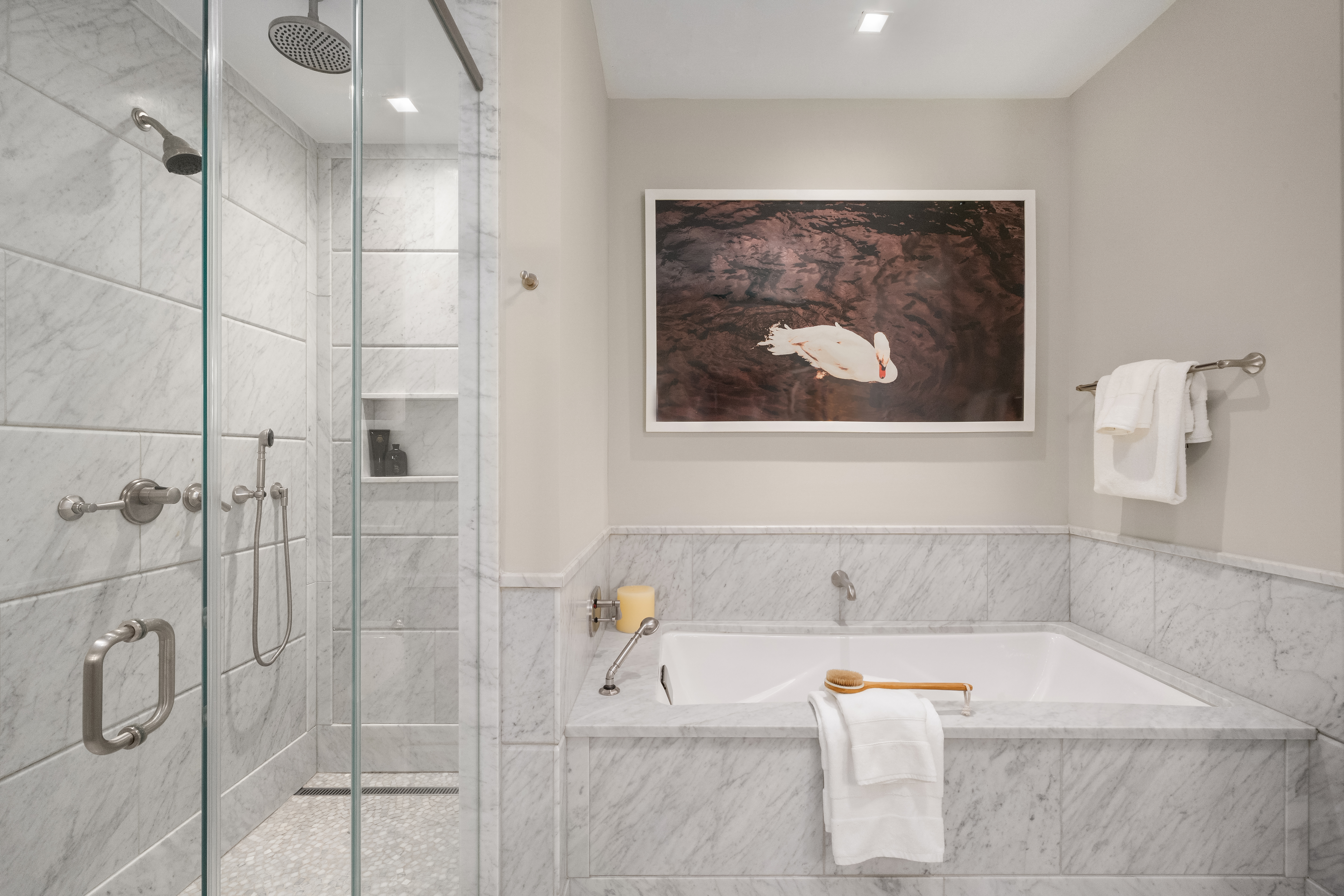 10 Madison Square West, Unit 12D Manhattan, NY 10010 - Photo 14 of 21 a bathroom with a tub and shower