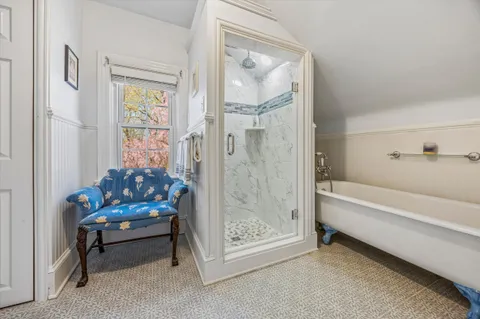 a bathroom with a bathtub sink and toilet