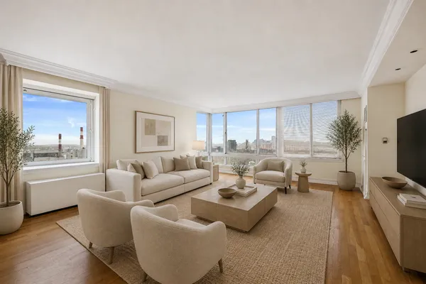 a living room with furniture a flat screen tv and a large window