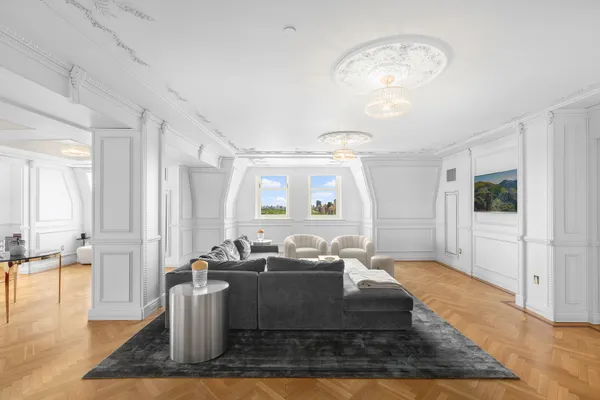 a living room with fireplace furniture and a table