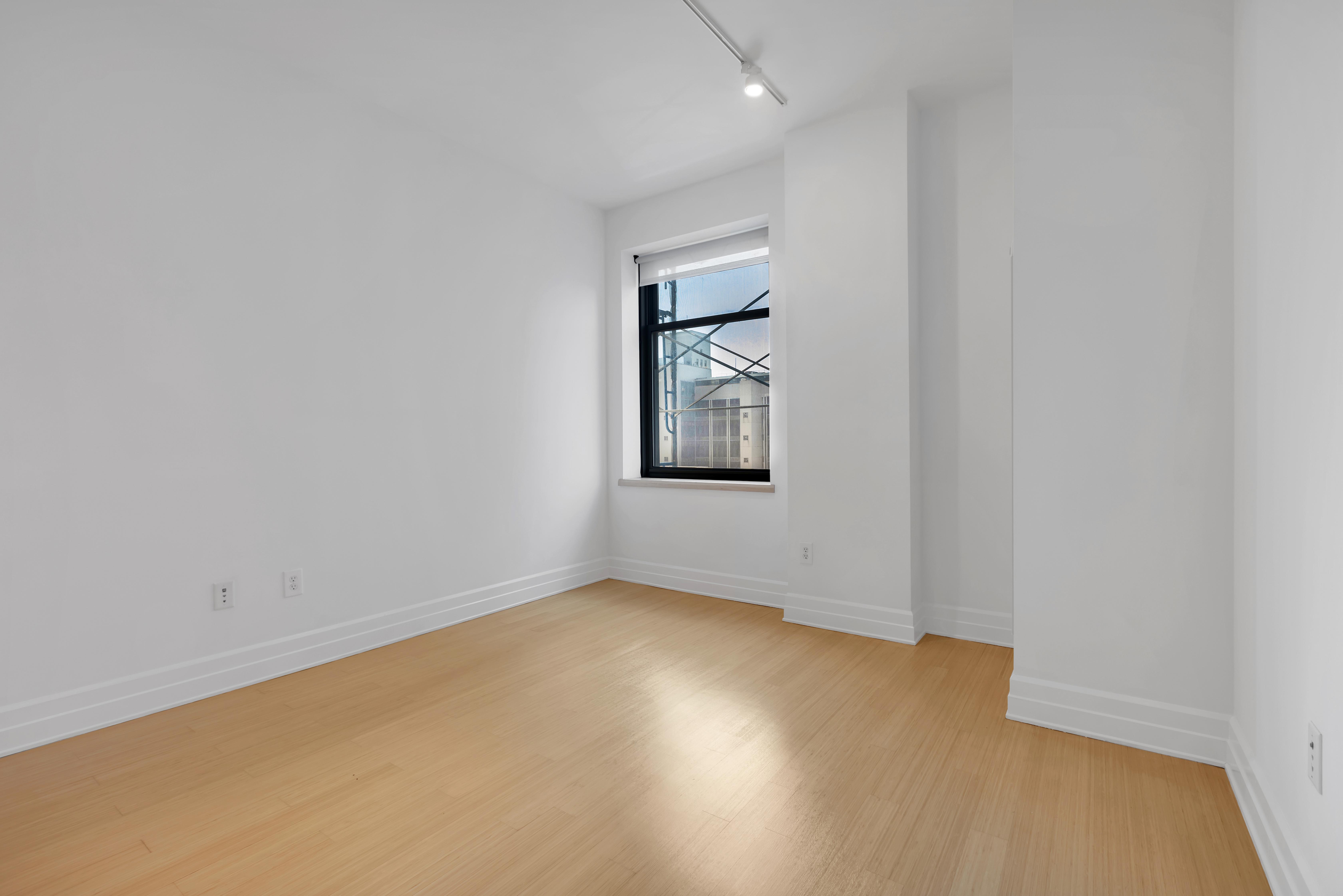 110 Livingston Street, Unit 9P Brooklyn, NY 11201 - Photo 6 of 9 an empty room with windows