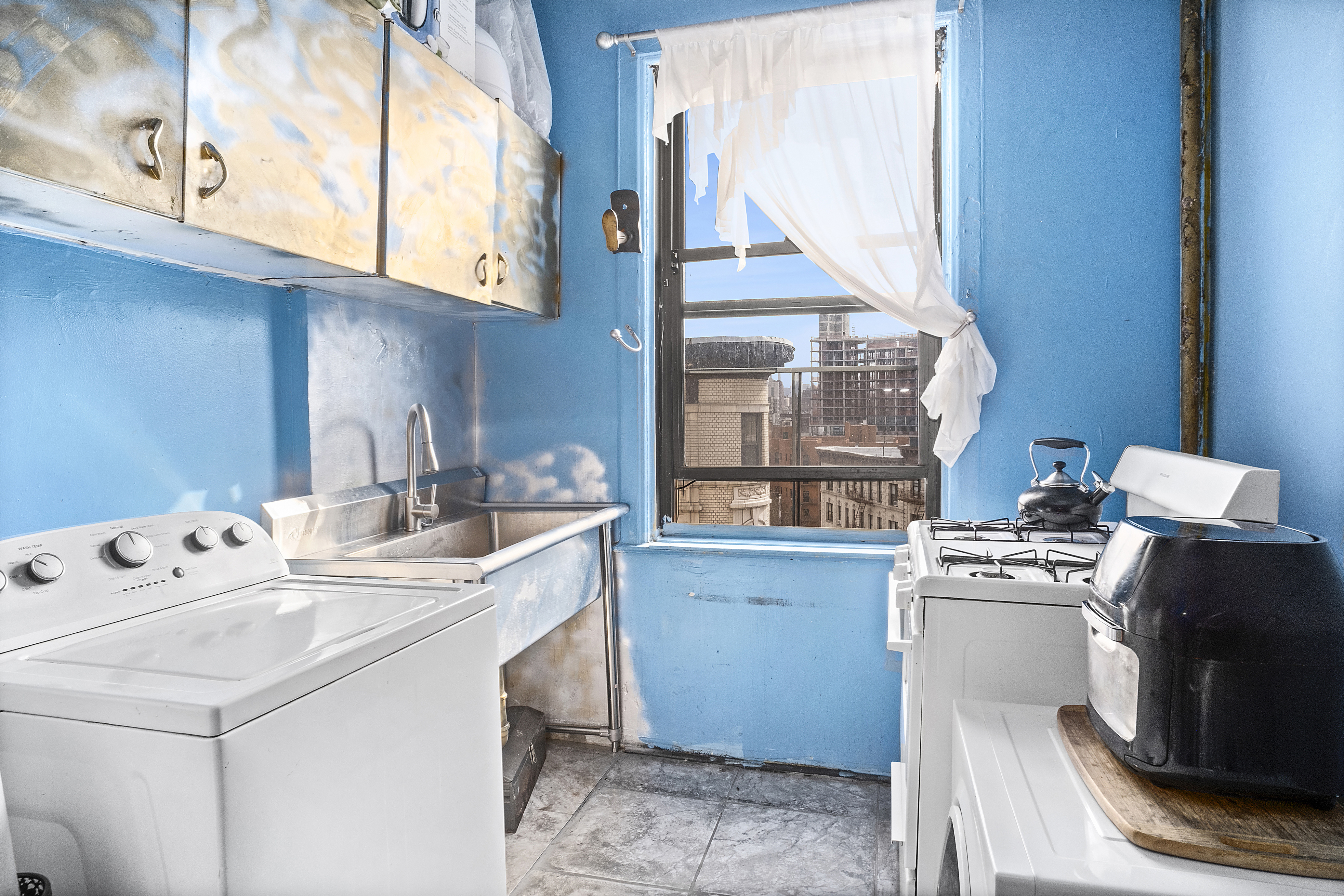 41 Convent Avenue, Unit 4L Manhattan, NY 10027 - Photo 2 of 13 a utility room with dryer and washer