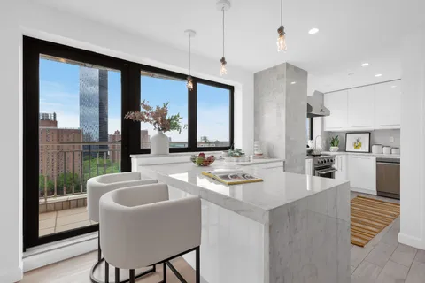 a bedroom with bed and a potted plant