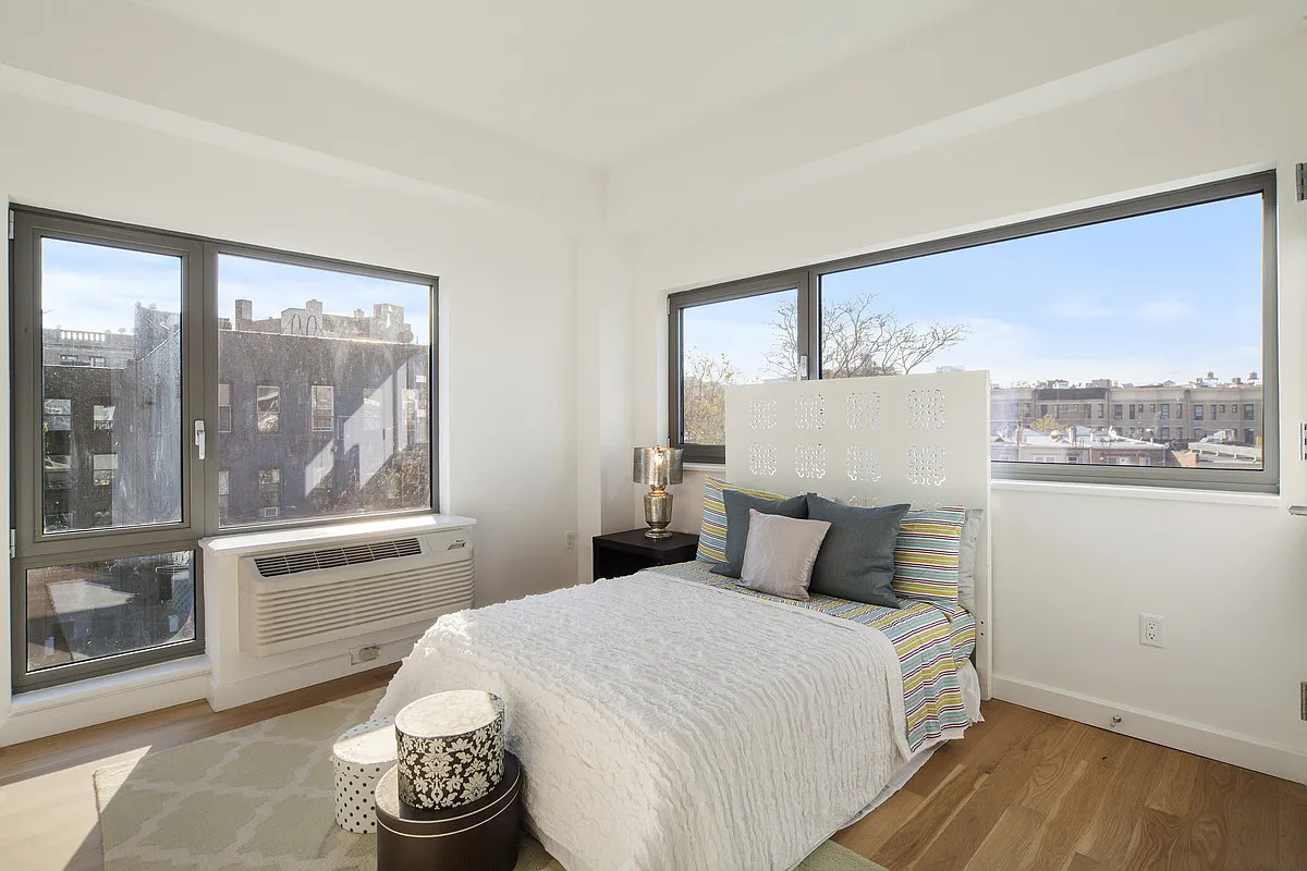 500 Sterling Place, Unit 5B Brooklyn, NY 11238 - Photo 3 of 13 a bedroom with a large bed and a window