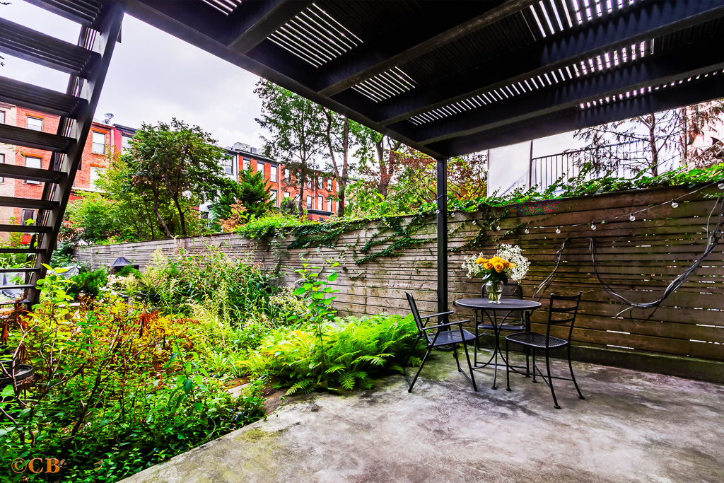 115 Lincoln Place, Unit 1 Brooklyn, NY 11217 - Photo 5 of 6 a outdoor seating area with lots of green space and glass windows