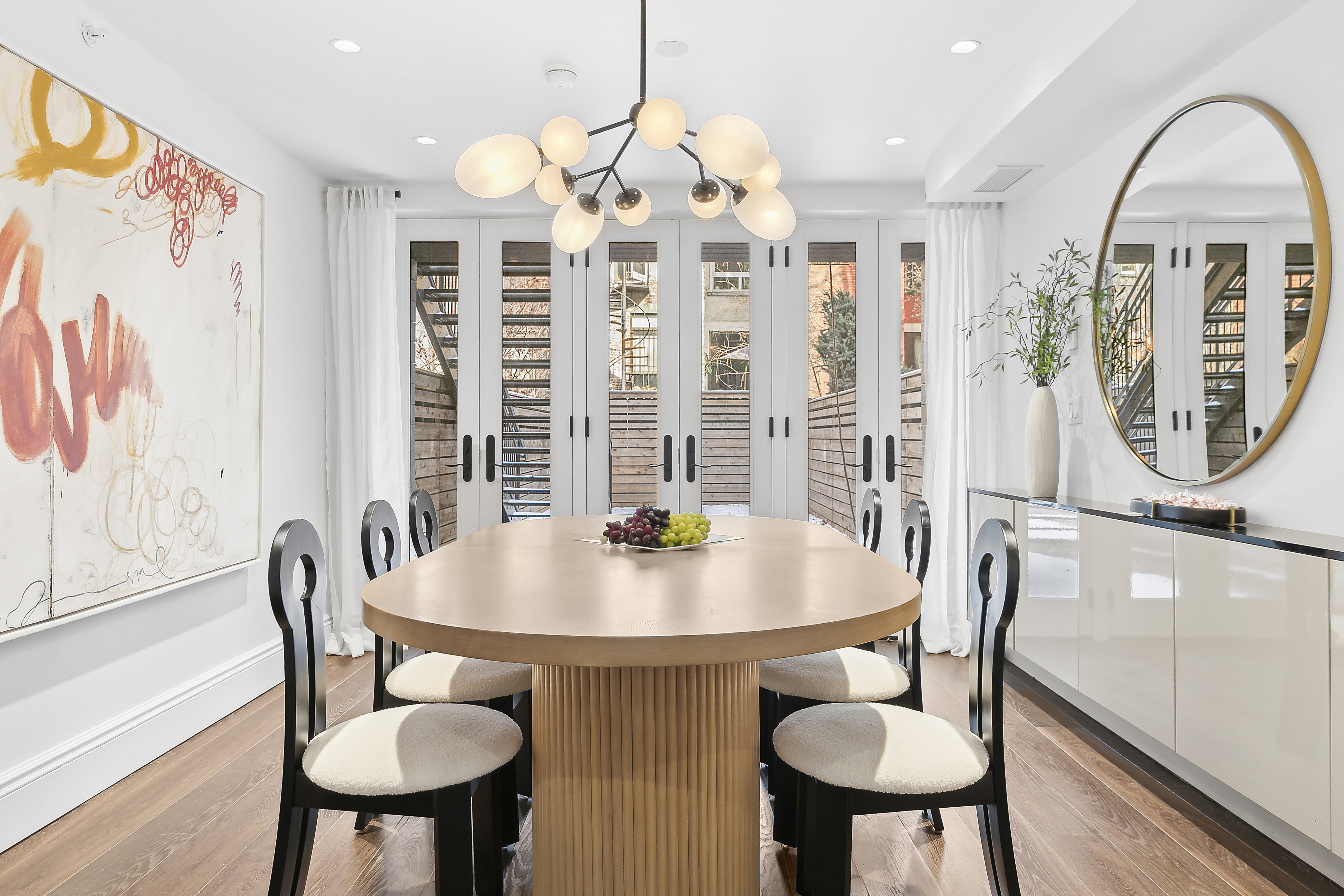47 West 94th Street Manhattan, NY 10025 - Photo 7 of 20 a view of a dining room with furniture window and wooden floor
