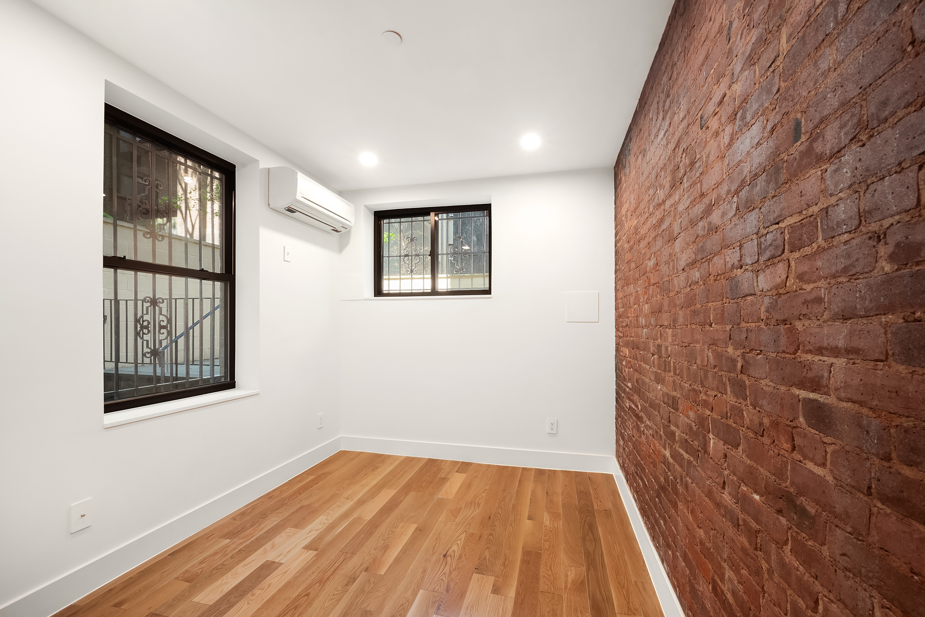 61 West 70th Street, Unit 1A Manhattan, NY 10023 - Photo 7 of 15 a view of empty room with wooden floor and fan