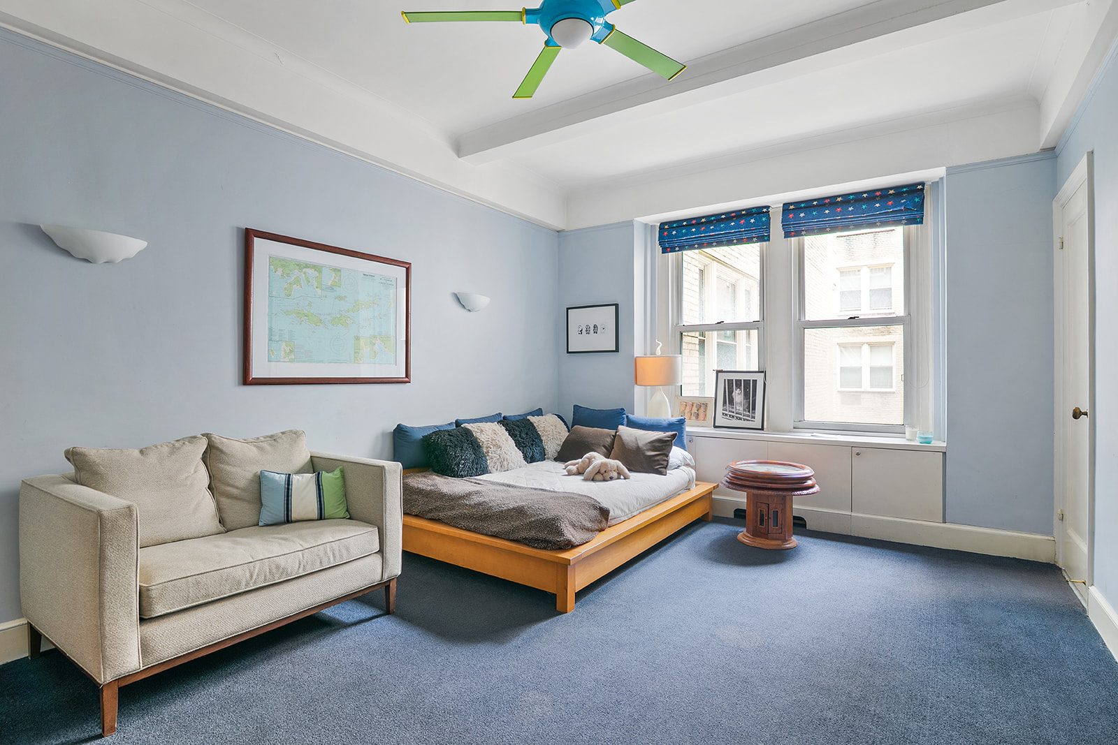 15 West 81st Street, Unit 10B Manhattan, NY 10024 - Photo 9 of 19 a living room with furniture and a large window