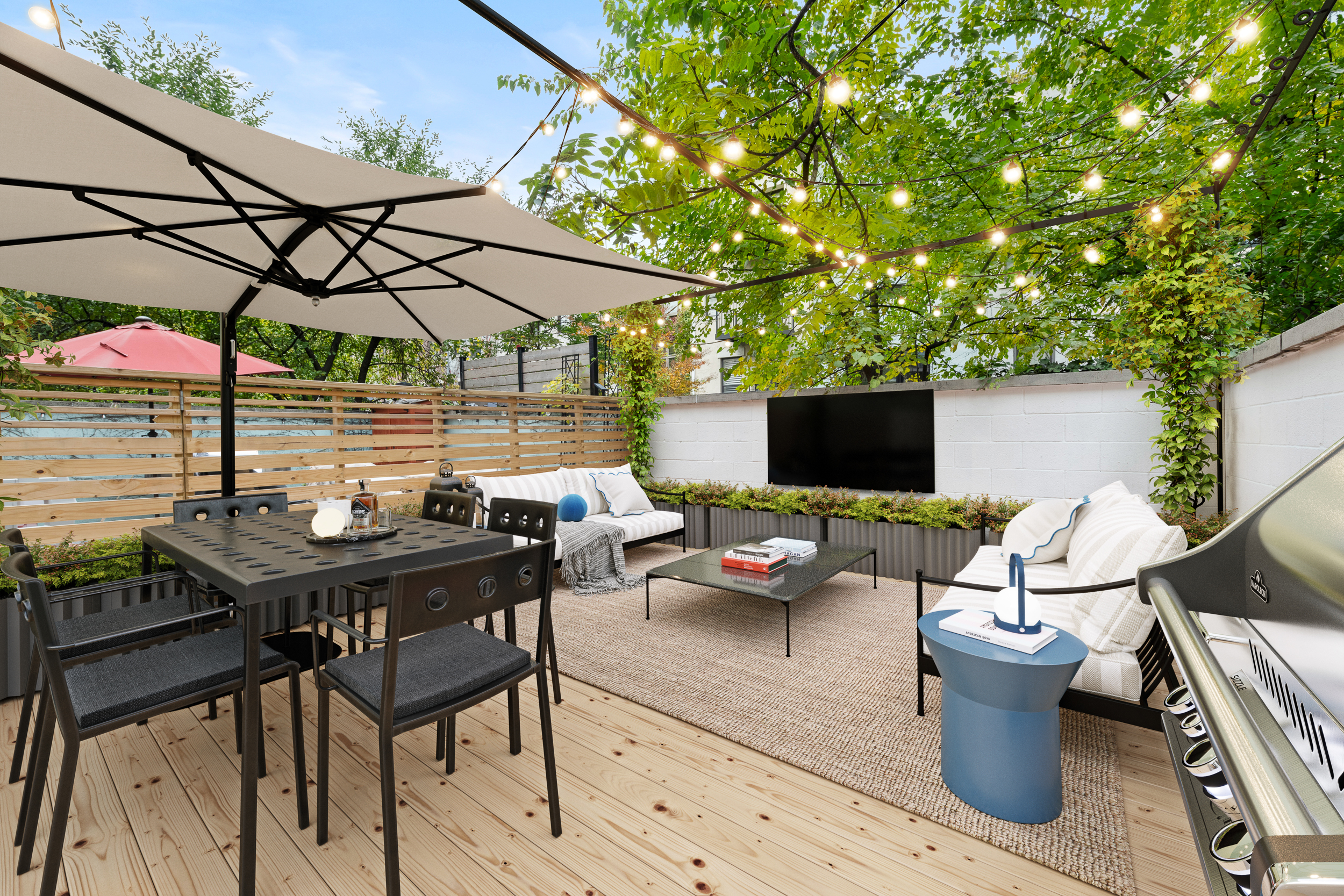 121 West 131st Street, Unit 2 Manhattan, NY 10027 - Photo 9 of 14 a view of a patio with table and chairs under an umbrella