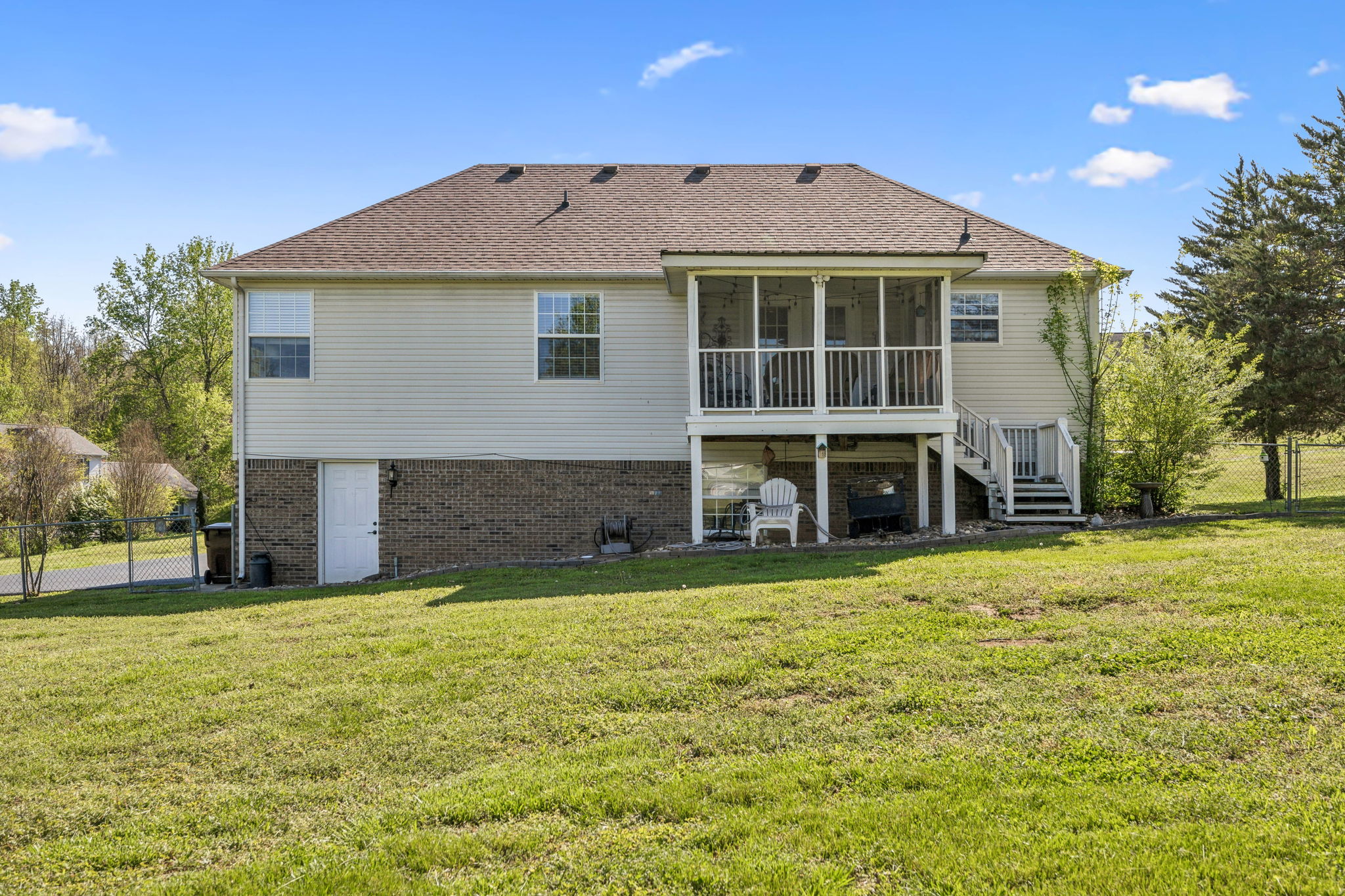 405 Billy Lane Spring Hill, TN 37174 - Photo 30 of 39 a view of a house with a yard and sitting area