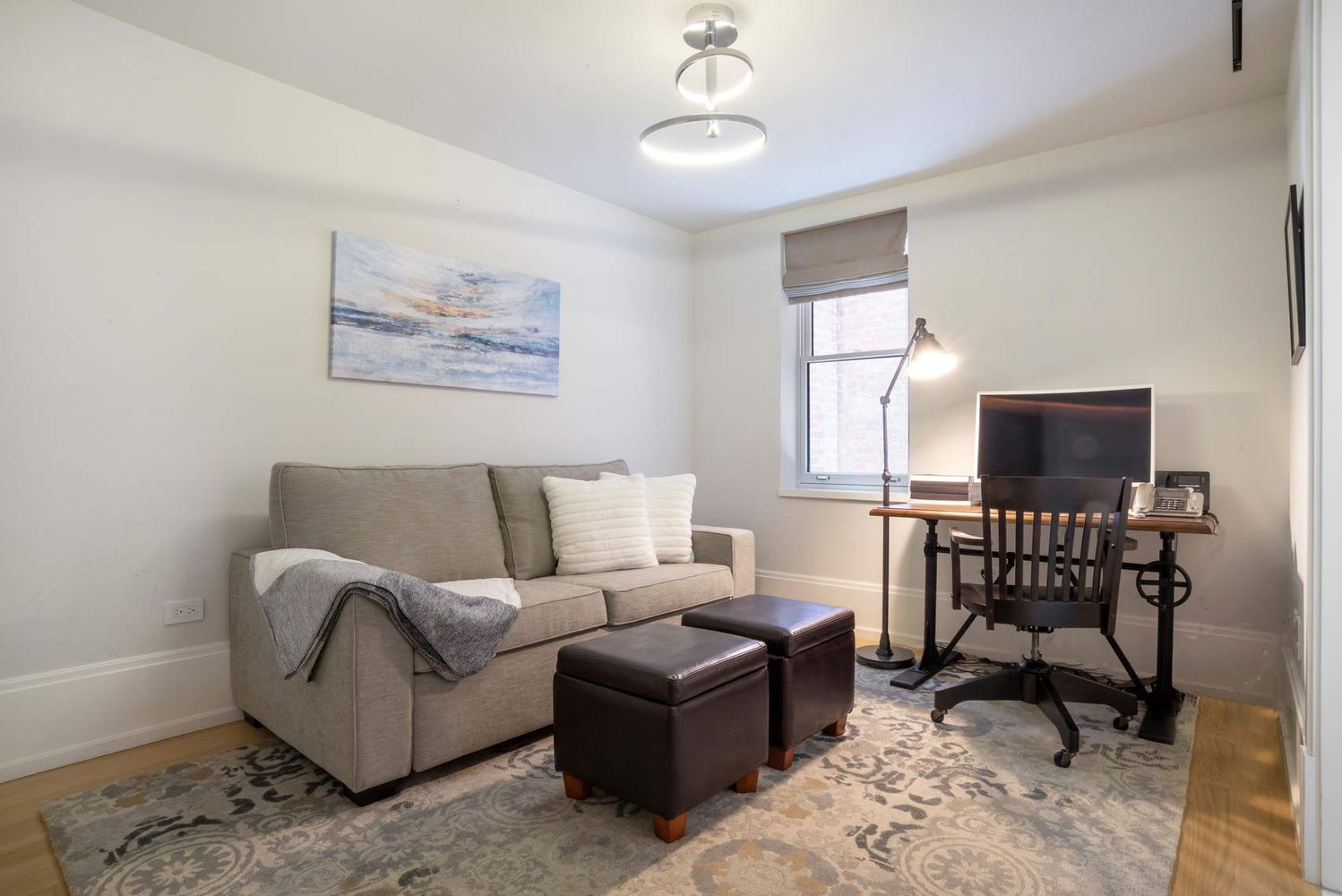 182 West 82nd Street, Unit 4E Manhattan, NY 10024 - Photo 18 of 25 a living room with furniture a flat screen tv and a window