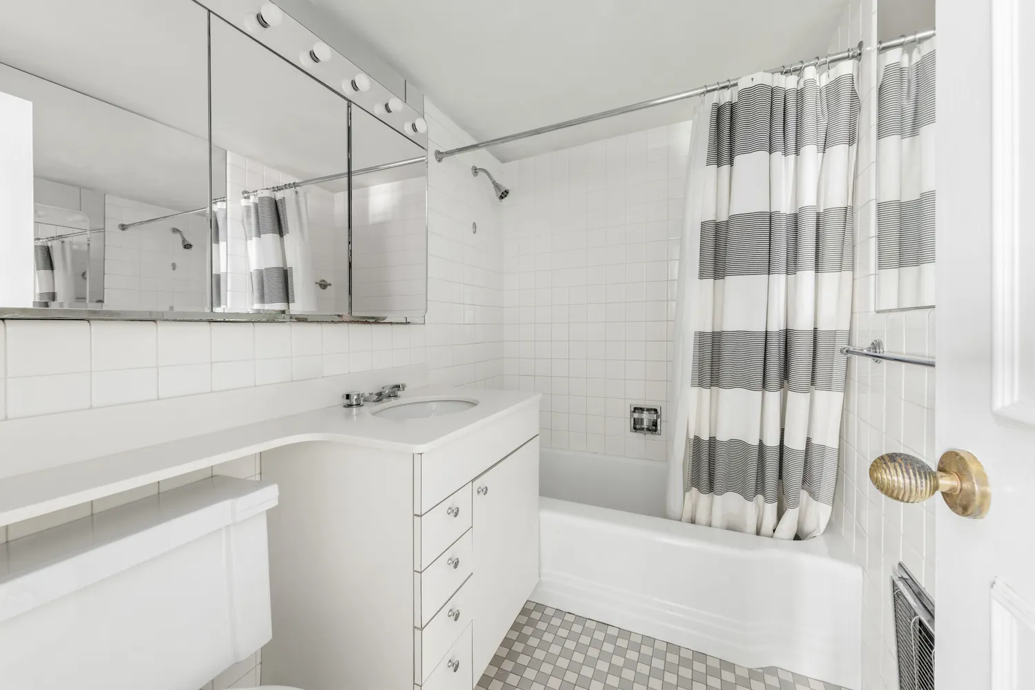 a bathroom with a sink and a shower