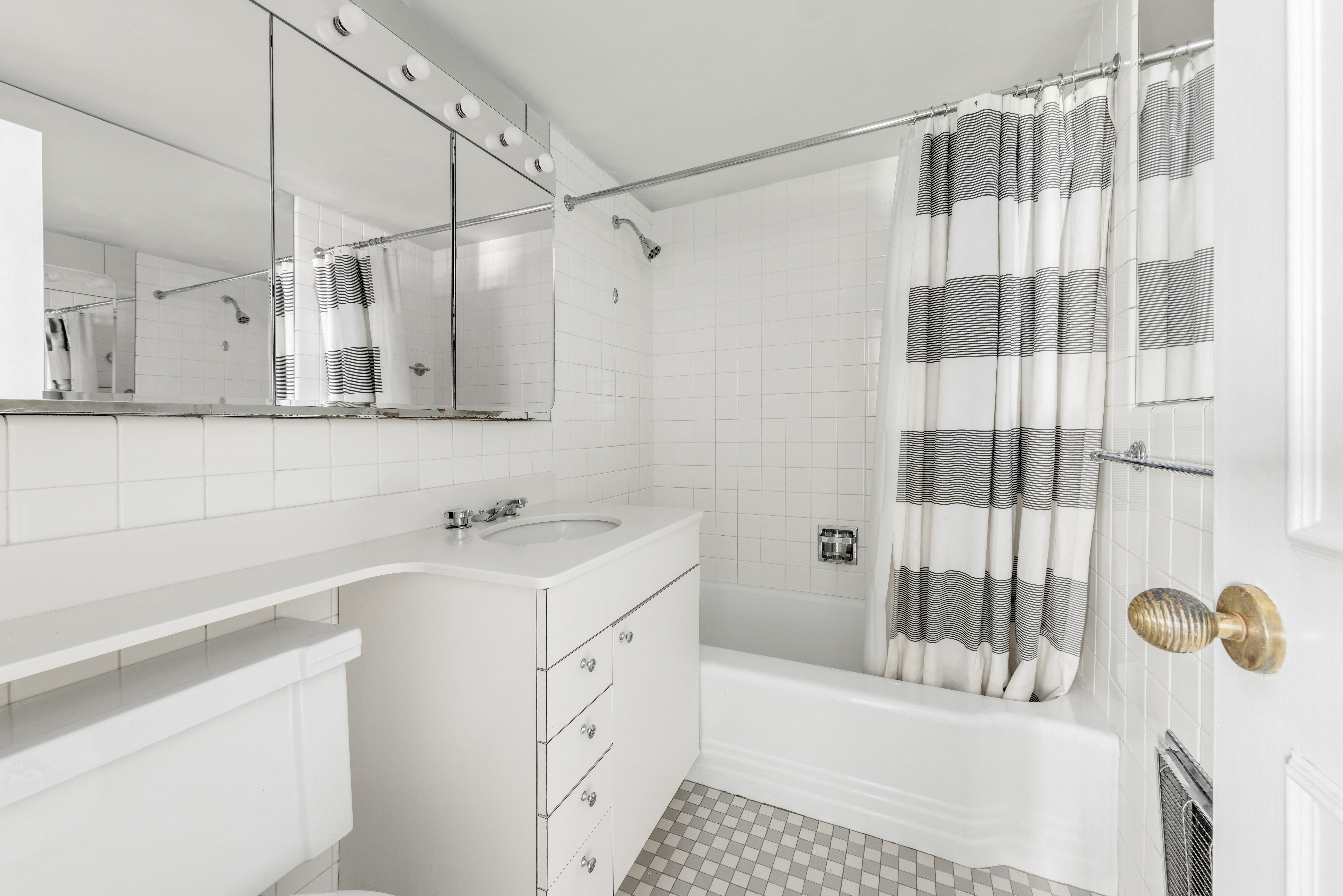 25 Sutton Place South, Unit 18L Manhattan, NY 10022 - Photo 7 of 11 a bathroom with a sink and a shower