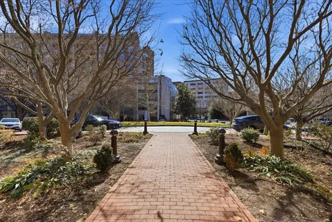 a view of a street with a building in the background