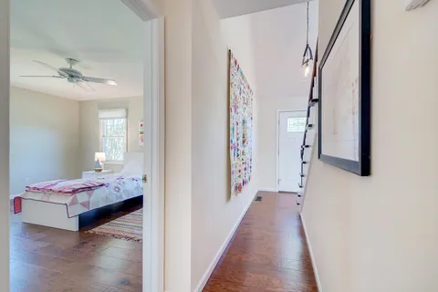 a view of an entryway with wooden floor