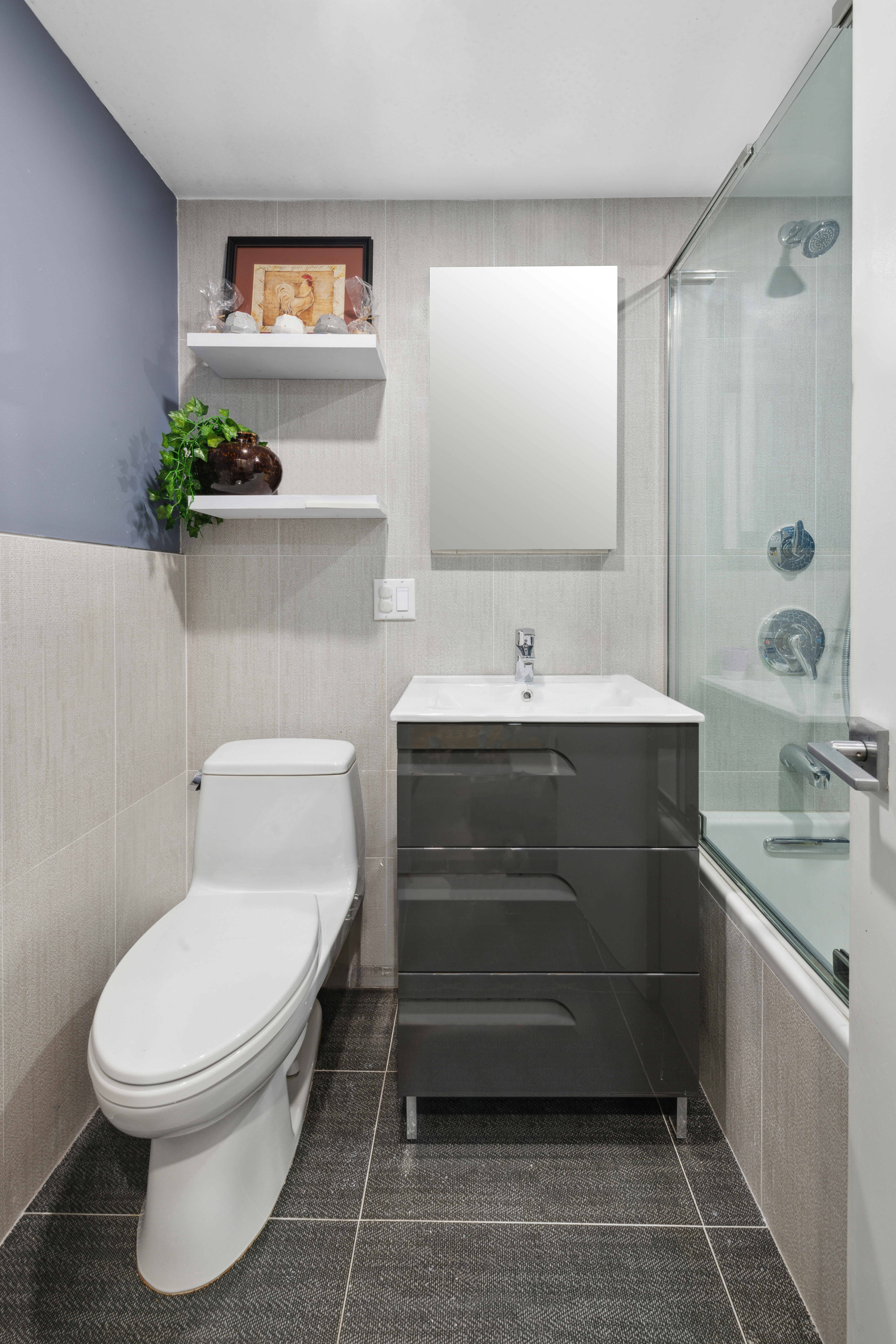 400 East 77th Street, Unit 1CD Manhattan, NY 10075 - Photo 13 of 18 a bathroom with a sink toilet and shower