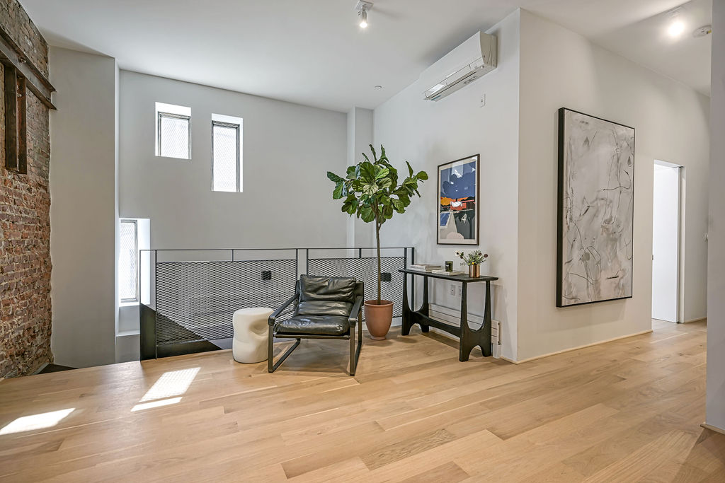 459 Harman Street, Unit 1 Manhattan, NY 10026 - Photo 5 of 17 a living room with furniture