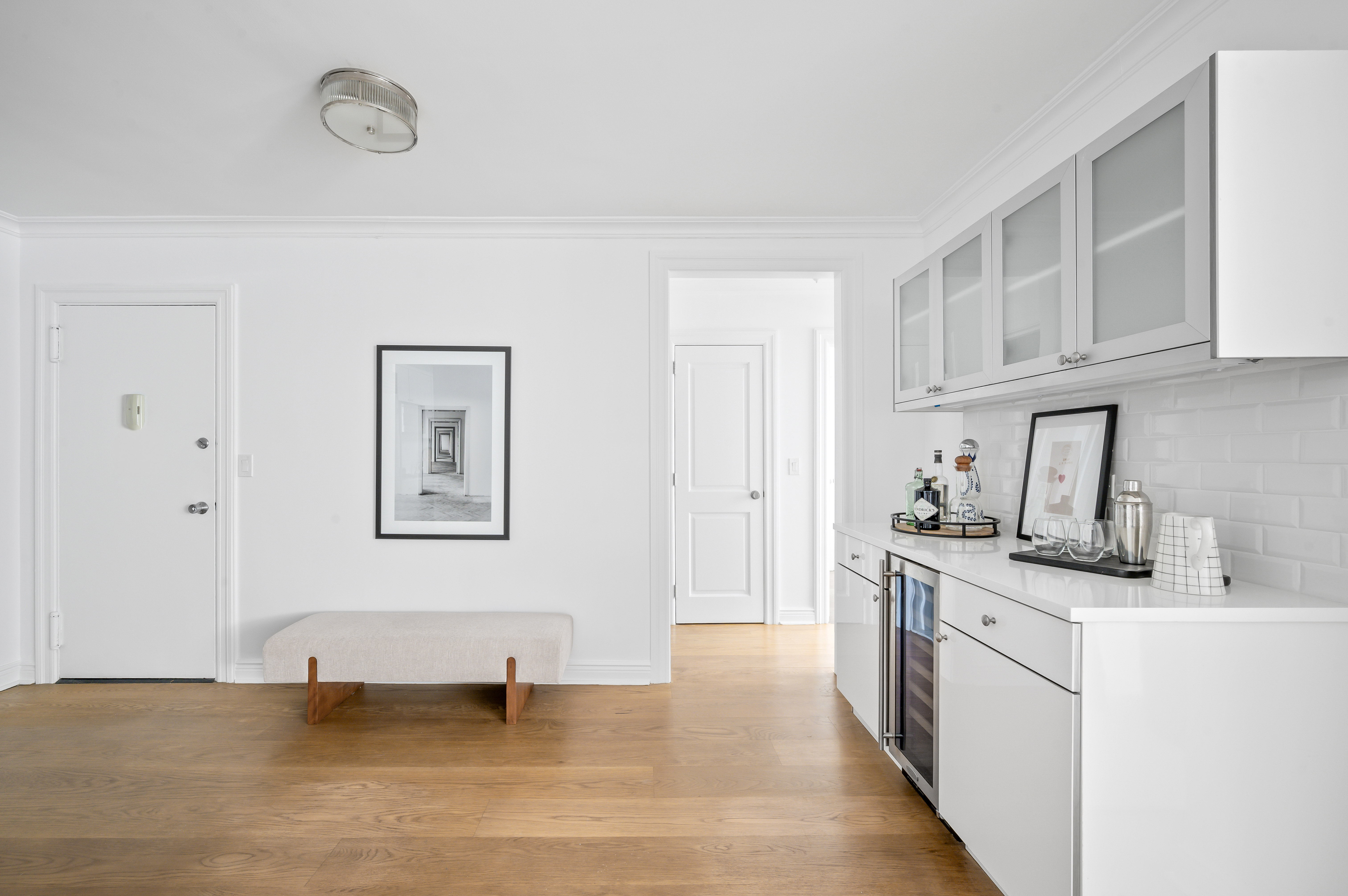 166 East 63rd Street, Unit 2J Manhattan, NY 10065 - Photo 8 of 14 a kitchen with stainless steel appliances granite countertop a sink stove and cabinets