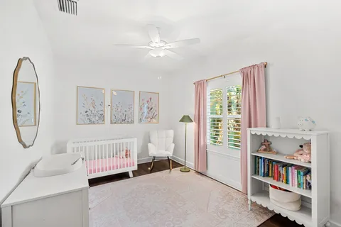 a bedroom with a bed and a book shelf