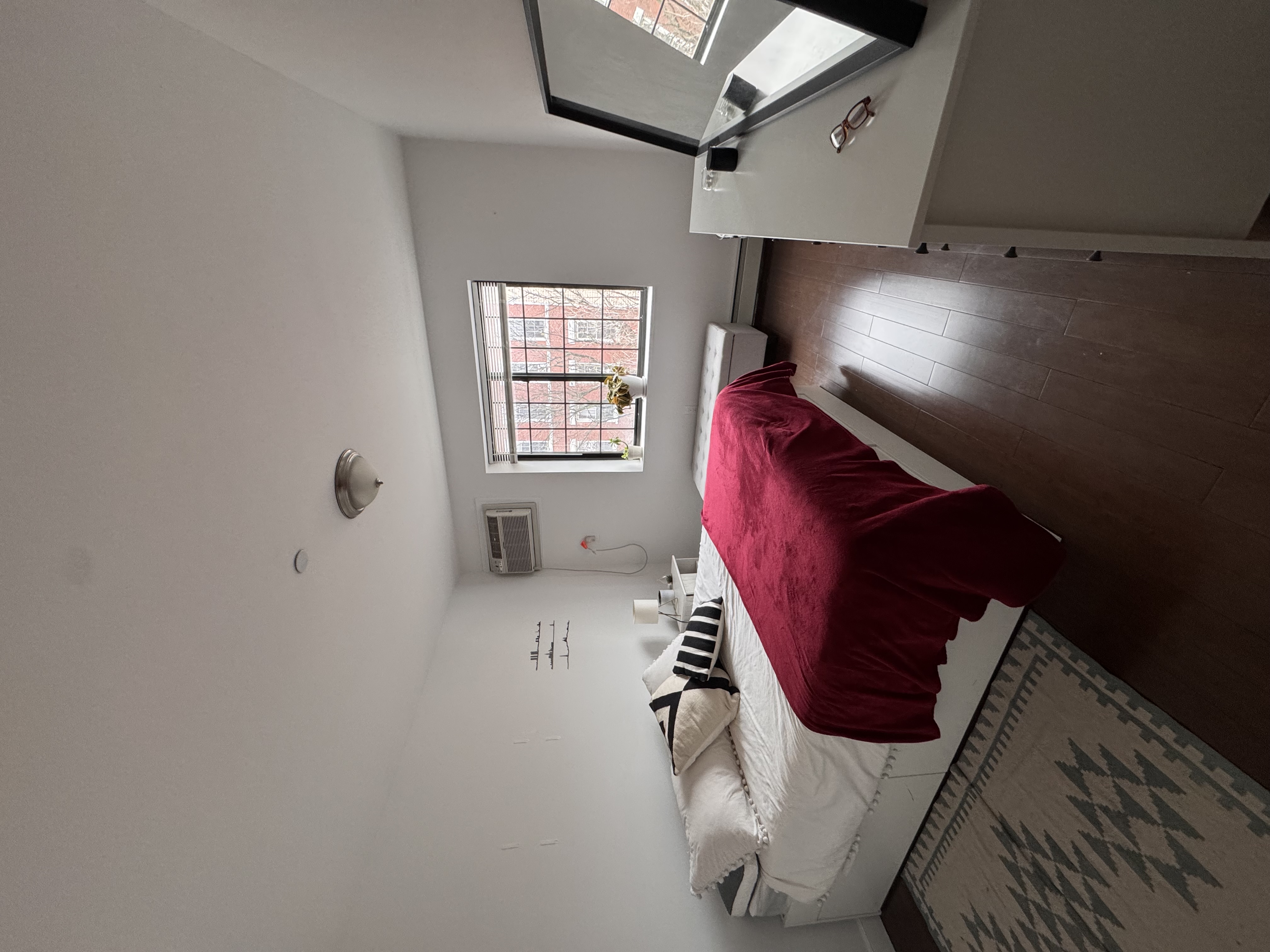 201 Huron Street, Unit 4F Brooklyn, NY 11222 - Photo 5 of 12 a spacious bedroom with a bed and window