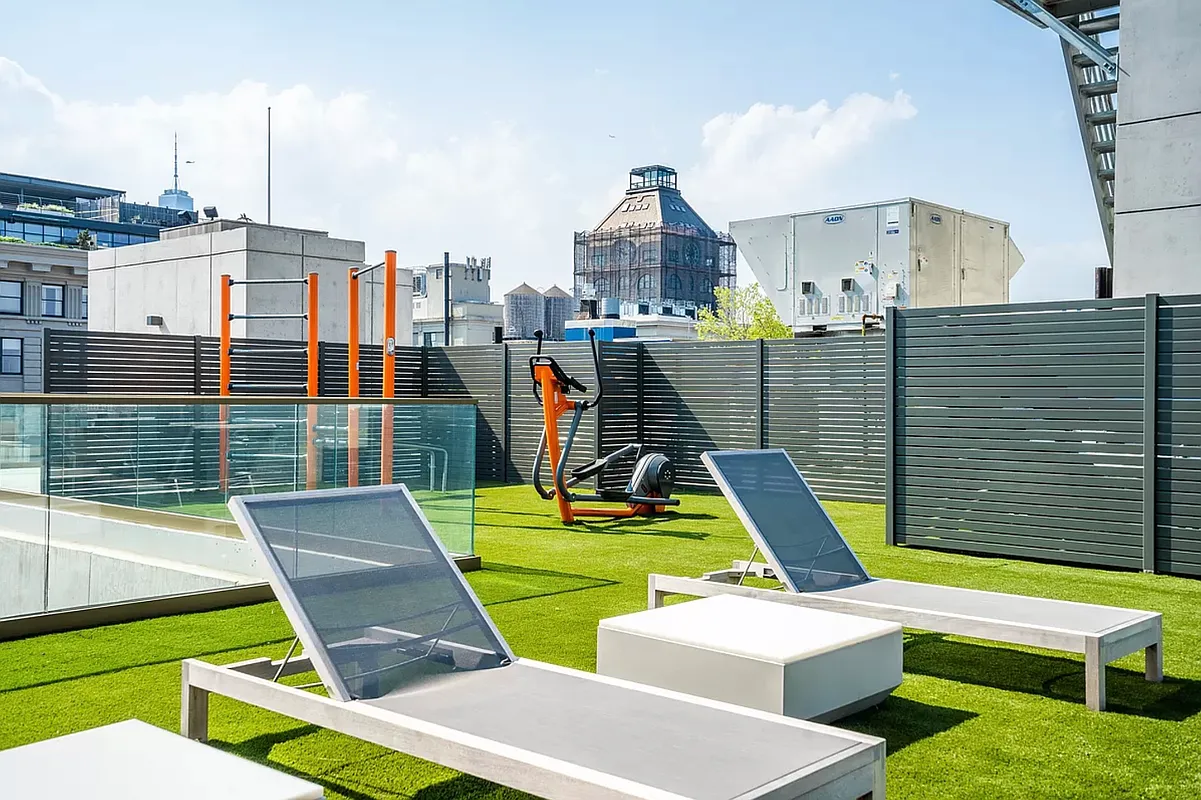 98 Front Street, Unit PH Brooklyn, NY 11201 - Photo 23 of 26 a view of a patio with a table and chairs