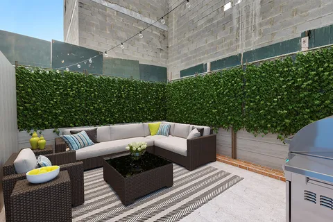 a view of a patio with couches and potted plants