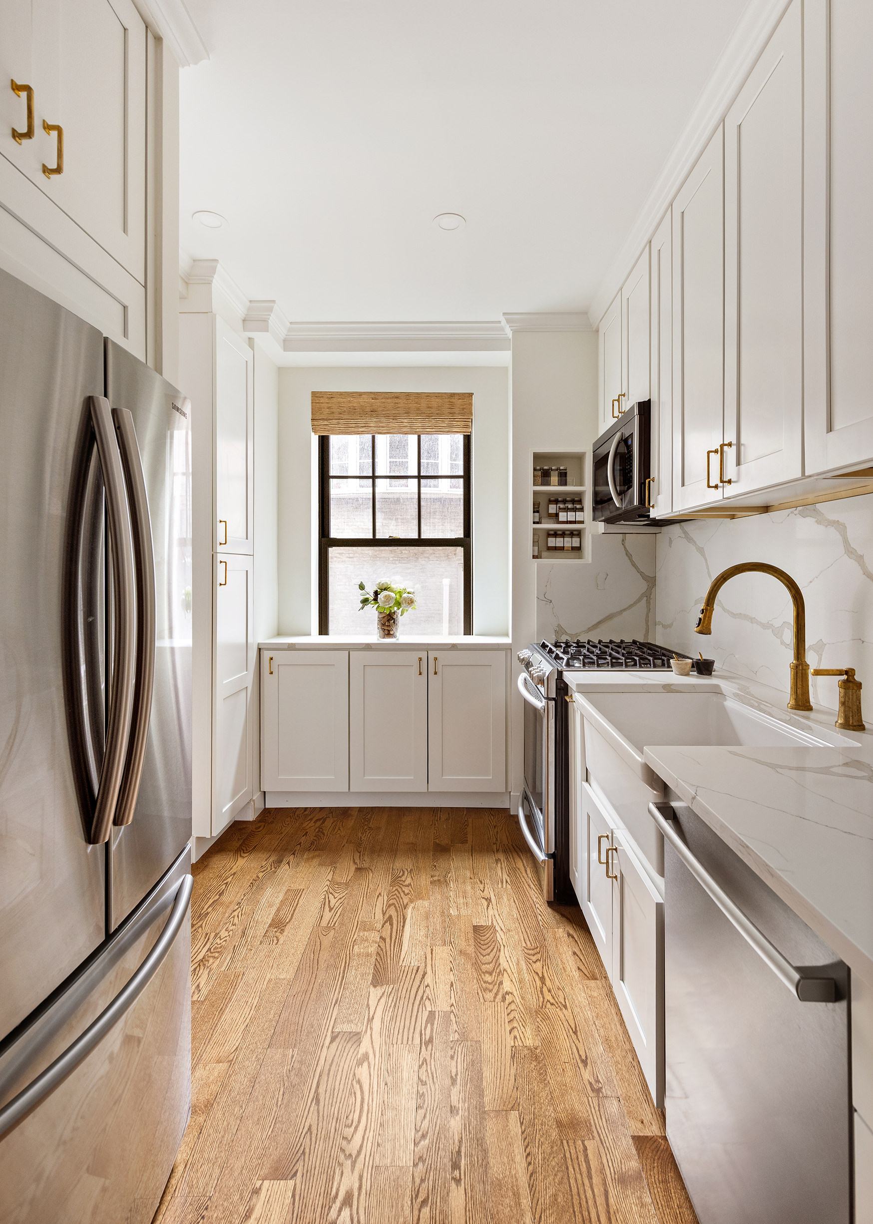 15 West 11th Street, Unit 3C Manhattan, NY 10011 - Photo 4 of 10 a kitchen with stainless steel appliances granite countertop a stove a sink and a refrigerator