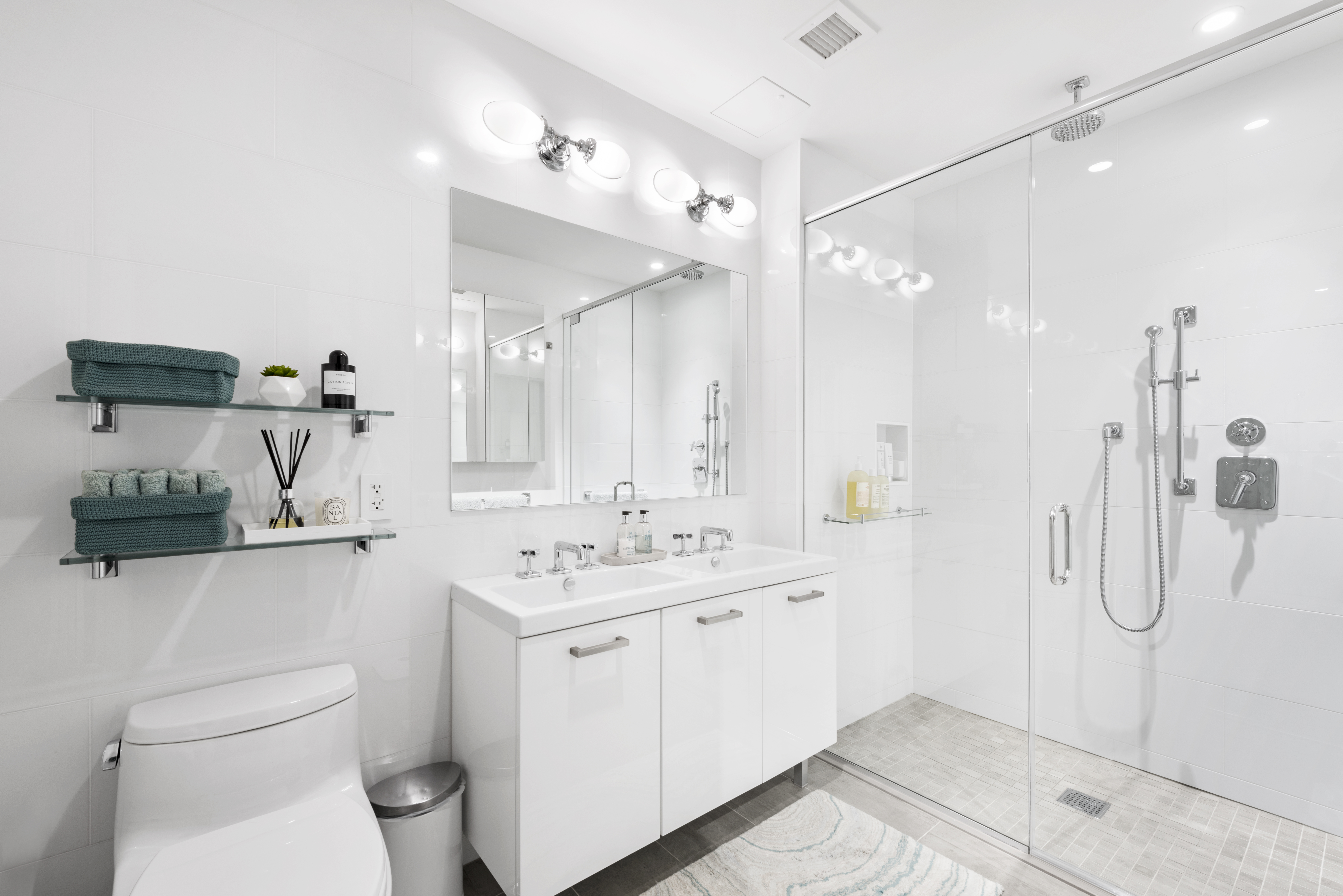 64 East 1st Street, Unit TH1 Manhattan, NY 10003 - Photo 11 of 15 a bathroom with a double vanity sink toilet and shower
