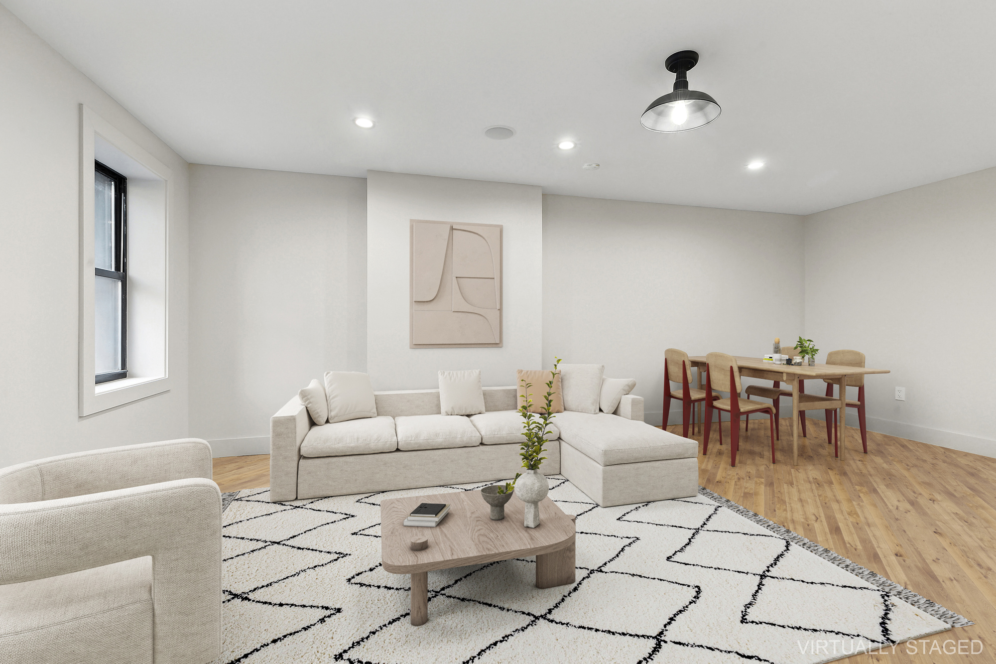 1265 Madison Street, Unit 1 Brooklyn, NY 11221 - Photo 2 of 11 a living room with furniture and a dining table with kitchen view
