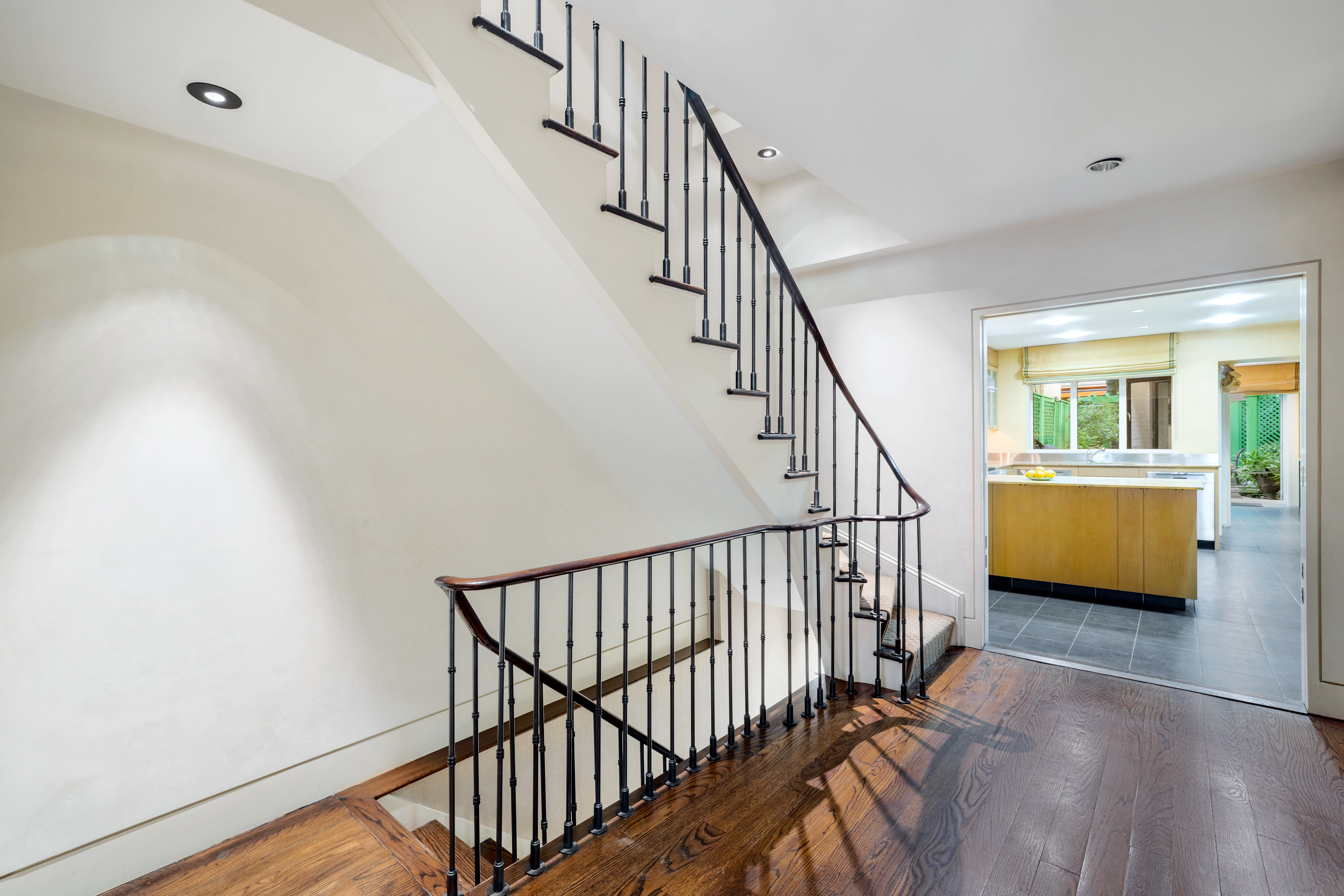 22 East 78th Street Manhattan, NY 10075 - Photo 11 of 23 a view of staircase with wooden floor and a rug