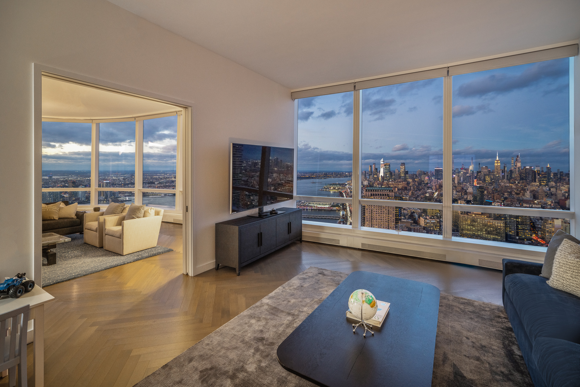 111 Murray Street, Unit 61W Manhattan, NY 10007 - Photo 4 of 35 a view of living room with furniture and a floor to ceiling window