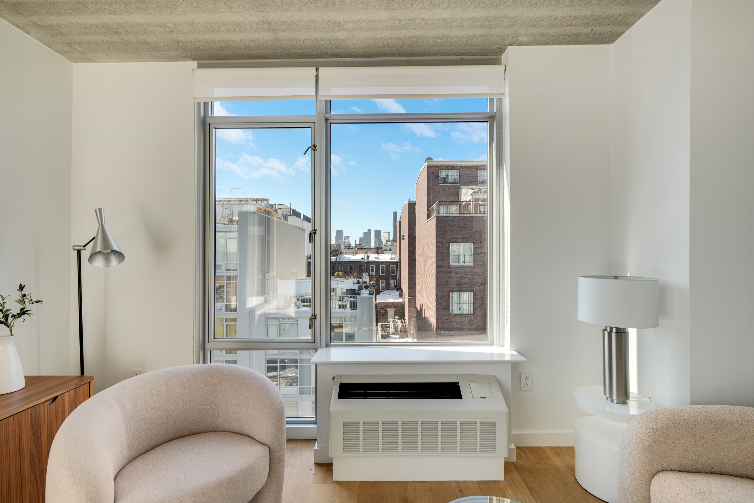 175 Spencer Street, Unit 6B Brooklyn, NY 11205 - Photo 8 of 15 a living room with furniture and a large window