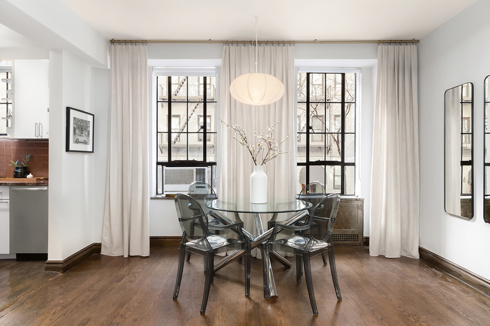 353 West 56th Street, Unit 2G Manhattan, NY 10019 - Photo 2 of 13 a view of a dining room with furniture window and wooden floor