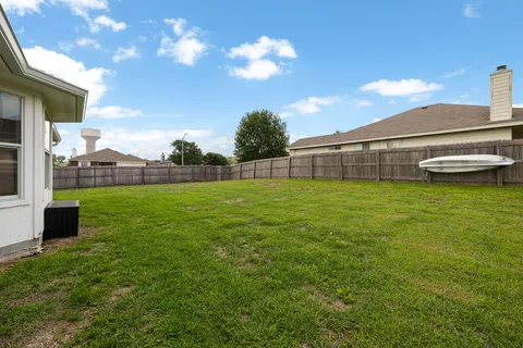 a view of a backyard with a garden and plants