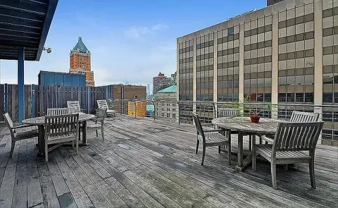 a roof deck view with a seating space