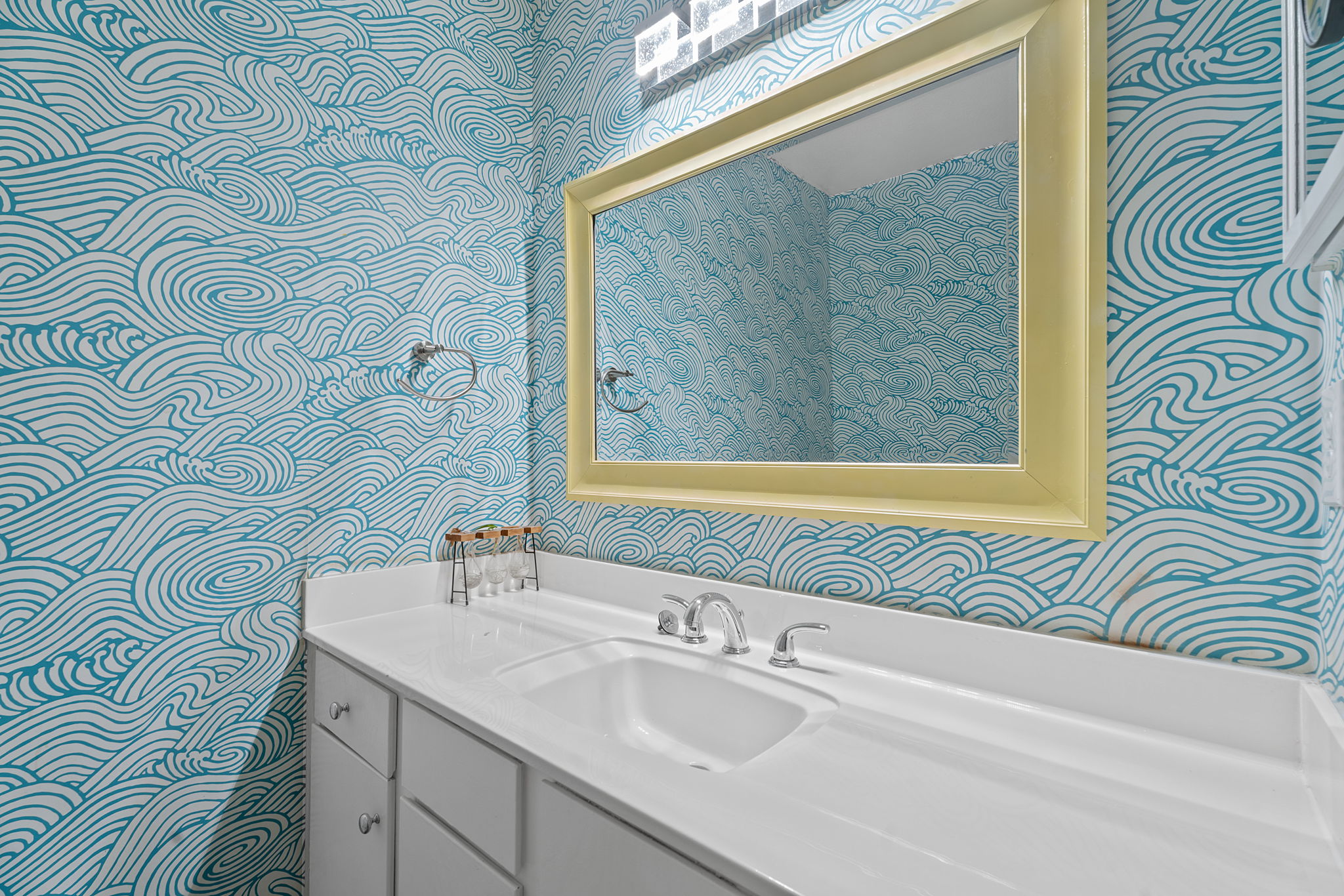 1510 West N Loop Boulevard, Unit 424 Austin, TX 78756 - Photo 18 of 25 a bathroom with a sink a mirror and a shower