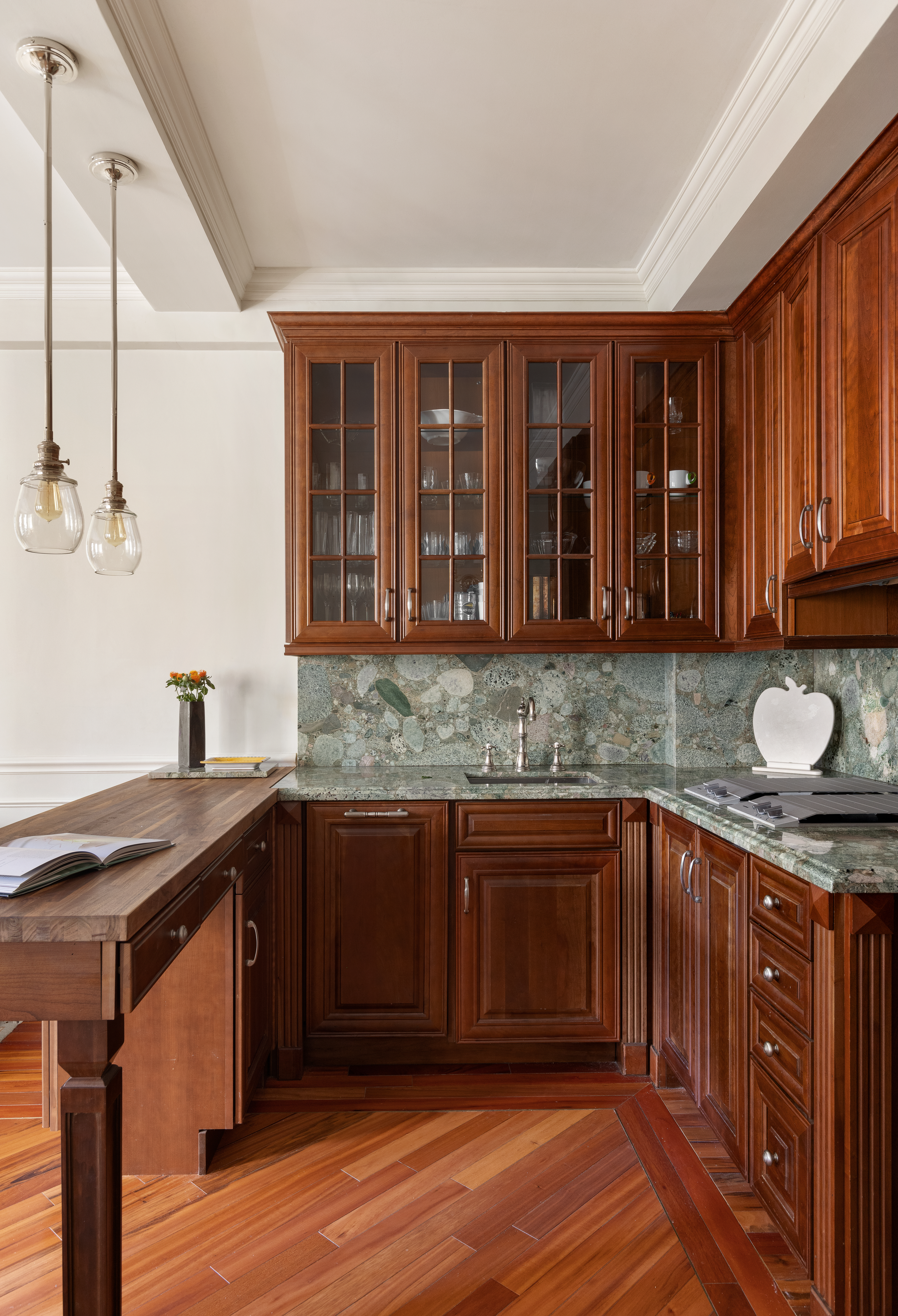 30 5th Avenue, Unit 3H Manhattan, NY 10011 - Photo 3 of 11 a kitchen with stainless steel appliances granite countertop wooden cabinets a stove and a sink