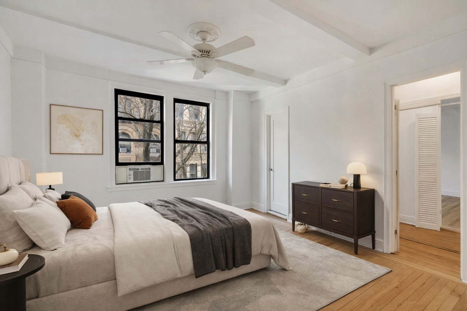 74 West 68th Street, Unit 5A Manhattan, NY 10023 - Photo 8 of 25 a bedroom with a bed and wooden floor