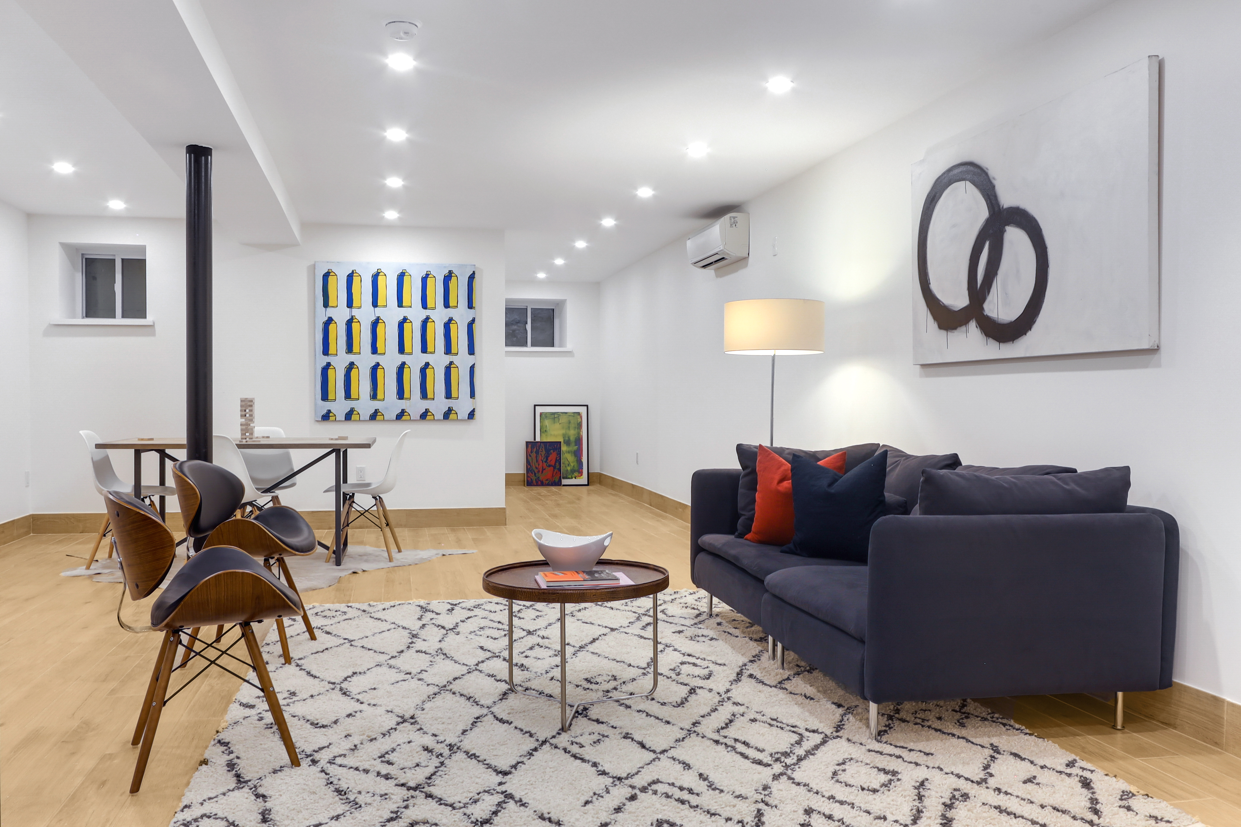 220 Lewis Avenue Brooklyn, NY 11221 - Photo 18 of 22 a living room with furniture and a rug