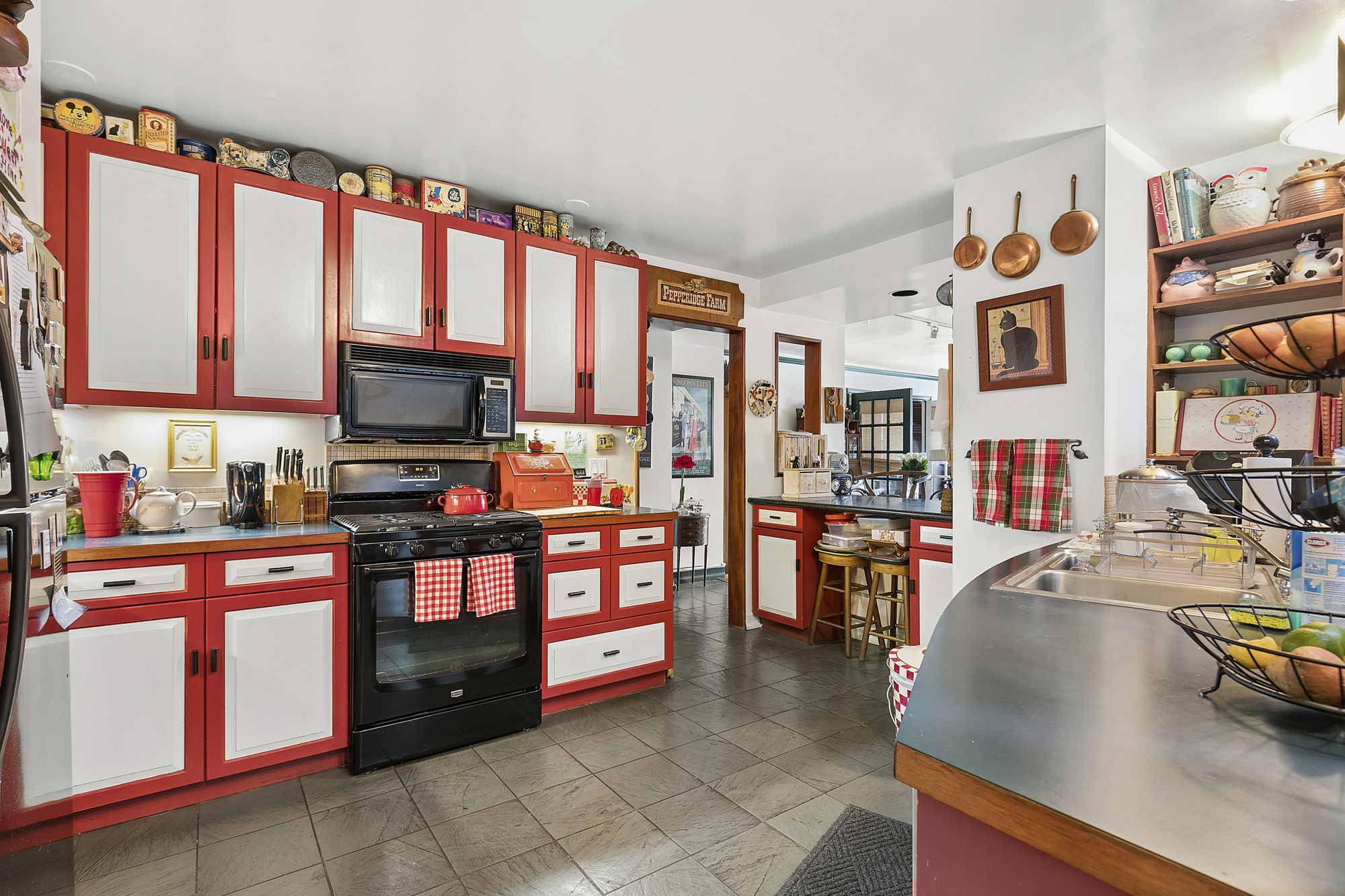101 West 12th Street, Unit 15JK Manhattan, NY 10011 - Photo 8 of 22 a kitchen with stainless steel appliances a stove and cabinets